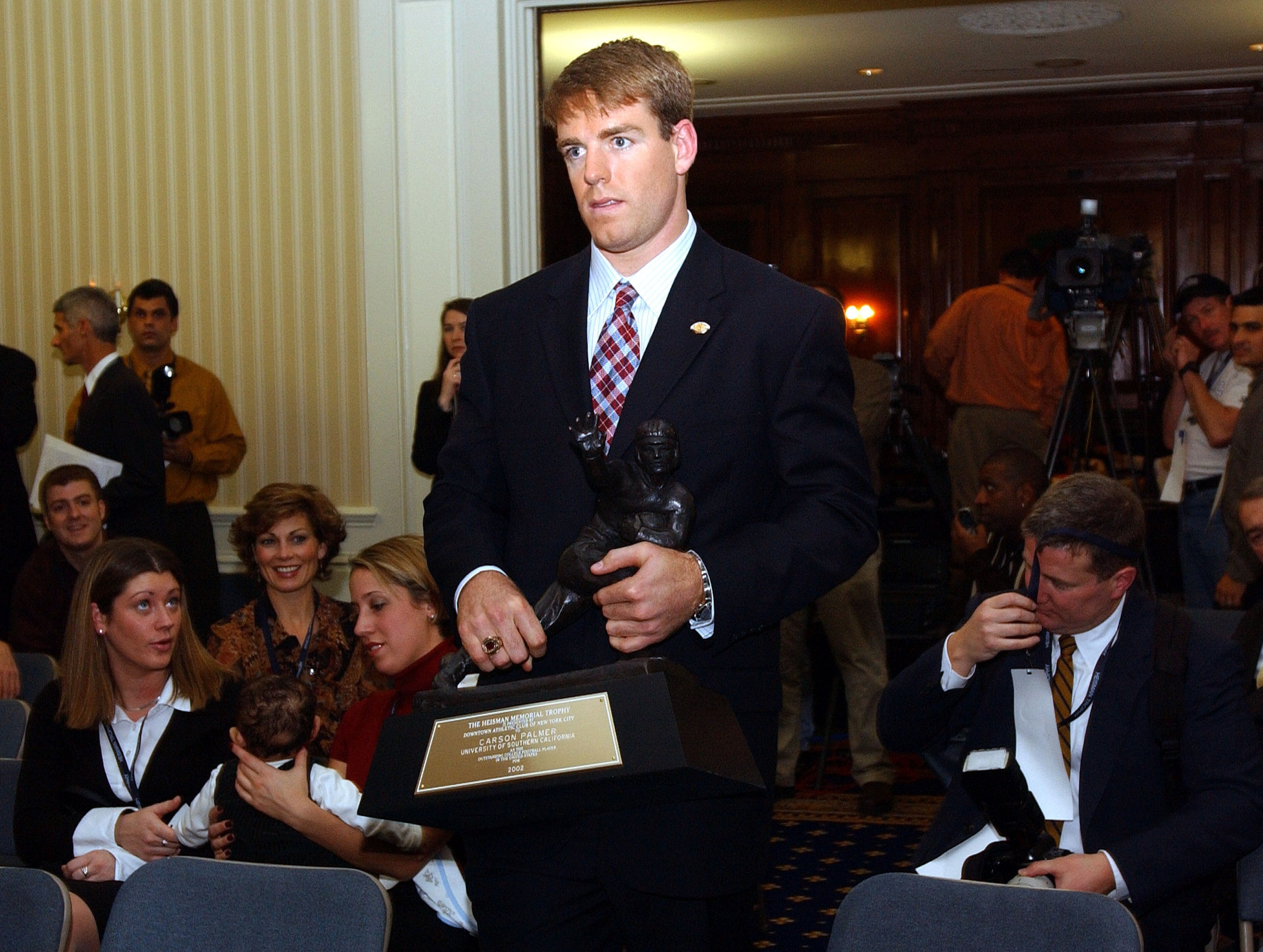 NEW YORK - DECEMBER 14:  Carson Palmer of the University of Southern California speaks with the press after winning the 68th annual Heisman Trophy Award at The Yale Club December 14, 2002 in New York City. The USC quarterback became the first west coast p