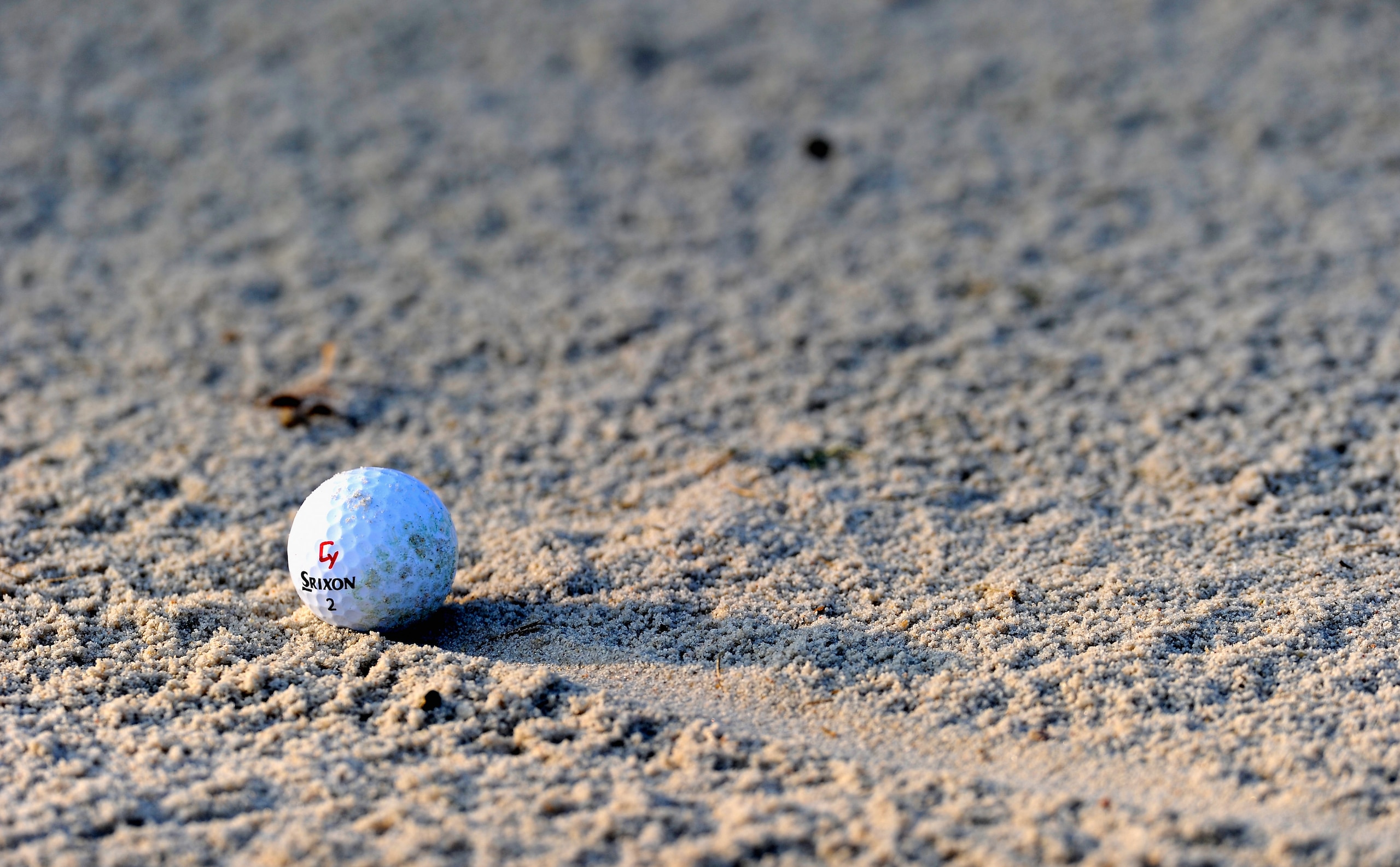 GIRONA, SPAIN - DECEMBER 10:  A ball in a bunker during the final round of the European Tour qualifying school final stage at PGA golf de Catalunya on December 10, 2010 in Girona, Spain.  (Photo by Stuart Franklin/Getty Images)