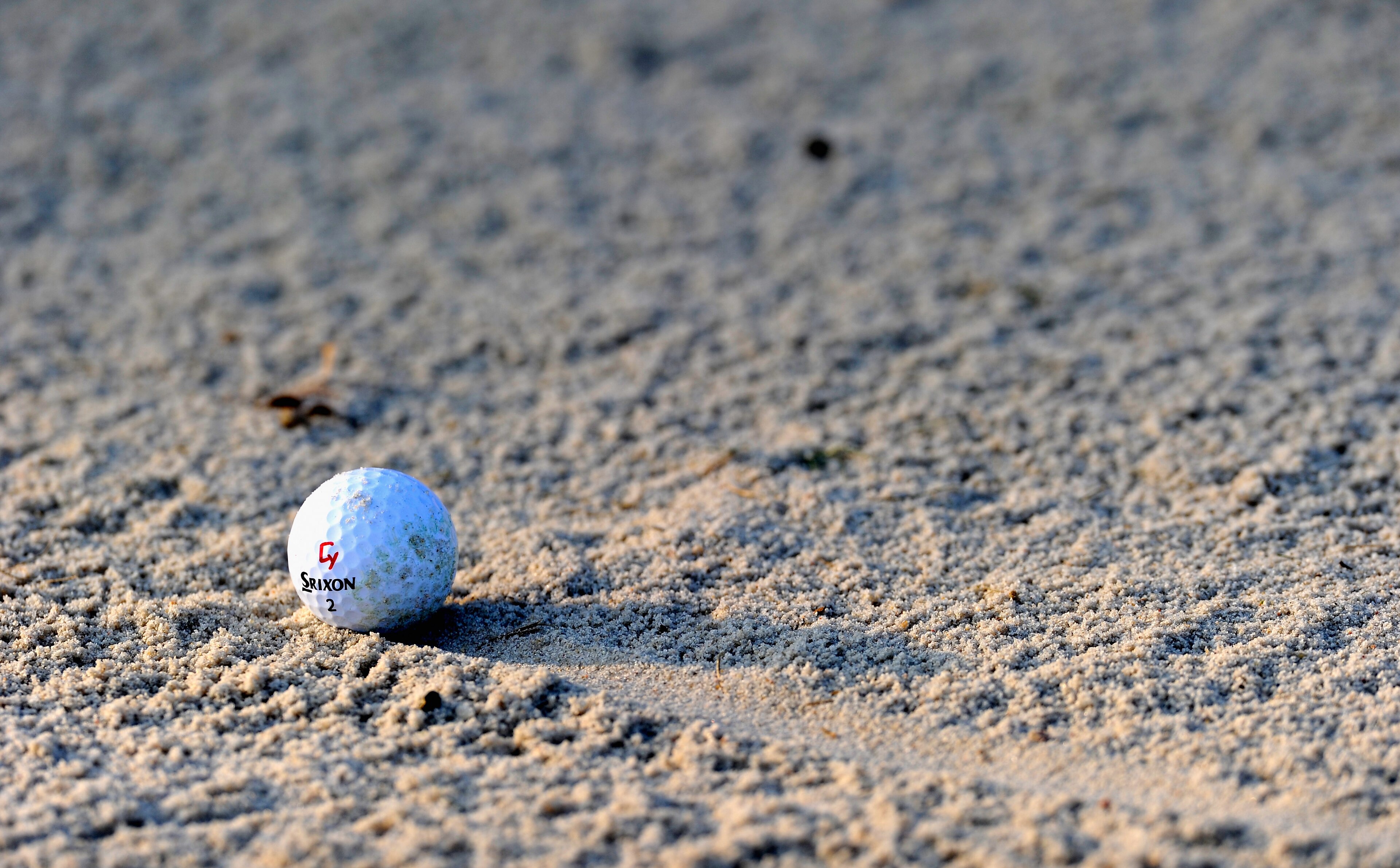 GIRONA, SPAIN - DECEMBER 10:  A ball in a bunker during the final round of the European Tour qualifying school final stage at PGA golf de Catalunya on December 10, 2010 in Girona, Spain.  (Photo by Stuart Franklin/Getty Images)