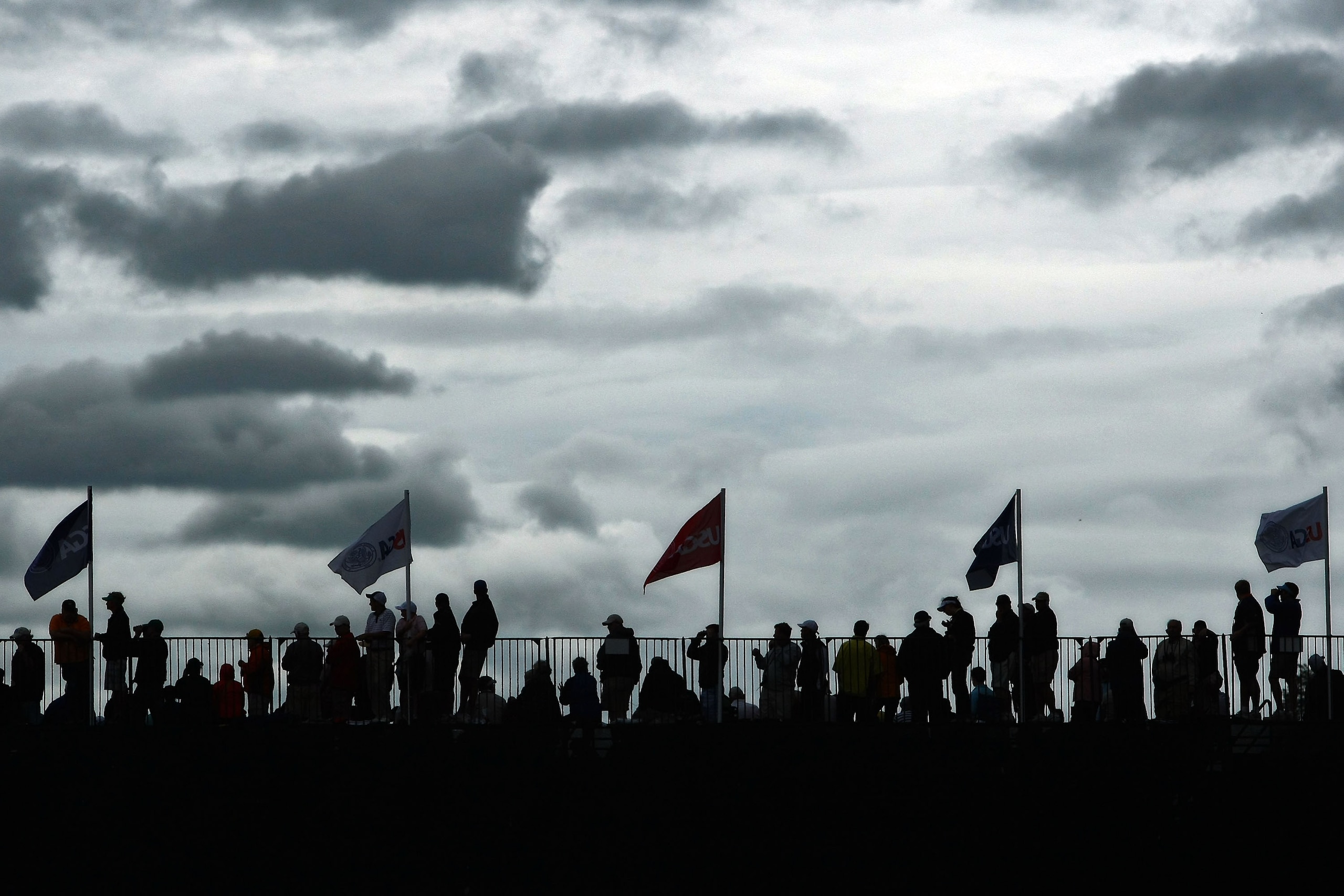 FARMINGDALE, NY - JUNE 22:  Golf fans watch play during the continuation of the final round of the 109th U.S. Open on the Black Course at Bethpage State Park on June 22, 2009 in Farmingdale, New York.  (Photo by Chris McGrath/Getty Images)