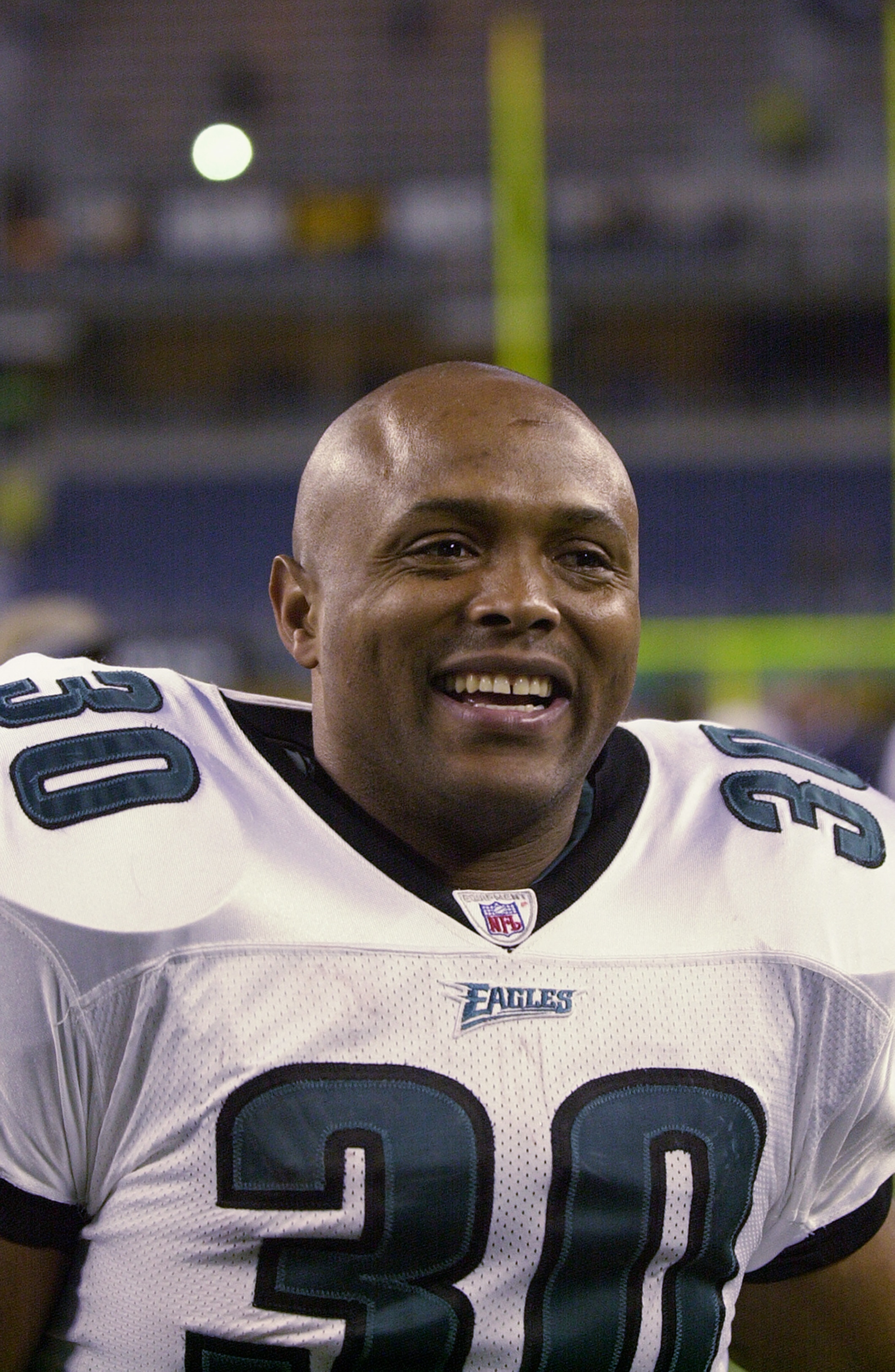 SEATTLE - DECEMBER 08:  Brian Mitchell #30 of the Philadelphia Eagles smiles as he walks off the field after their NFL game against the Seattle Seahawks at Seahawks Stadium on December 08, 2002 in Seattle Washington.  The Eagles defeated the Seahawks 27-2