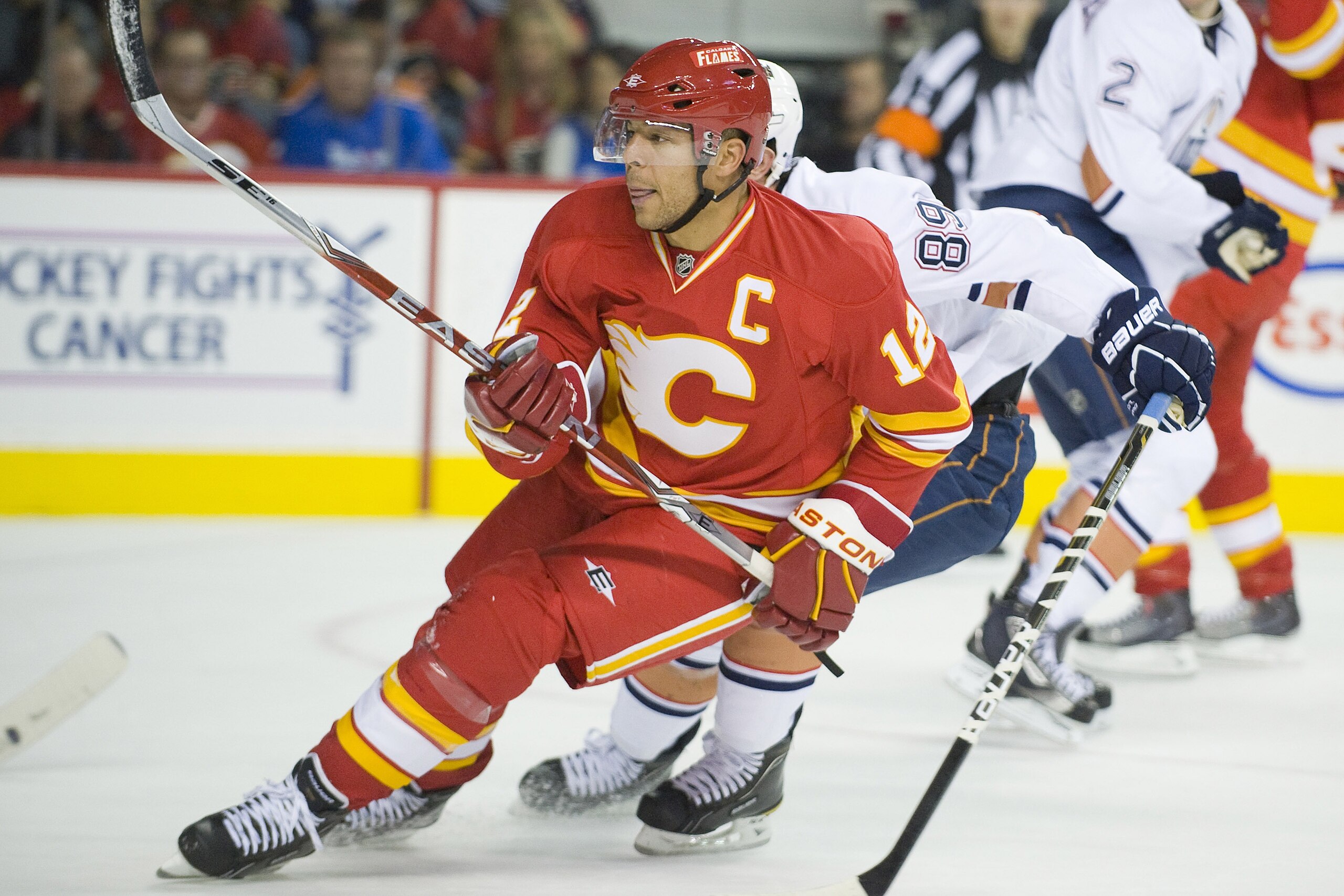 EDMONTON, CANADA - OCTOBER 16: Calgary Flames right wing Jarome Iginla #12 reacts to the play against the Edmonton Oilers at the Scotiabank Saddledome on October 16, 2010 in Calgary, Alberta, Canada. The Flames beat the Oilers 5-3. (Photo by Dylan Lyn EDMONTON, CANADA - OCTOBER 16: Calgary Flames right wing Jarome Iginla #12 reacts to the play against the Edmonton Oilers at the Scotiabank Saddledome on October 16, 2010 in Calgary, Alberta, Canada. The Flames beat the Oilers 5-3. (Photo by Dylan Lyn
