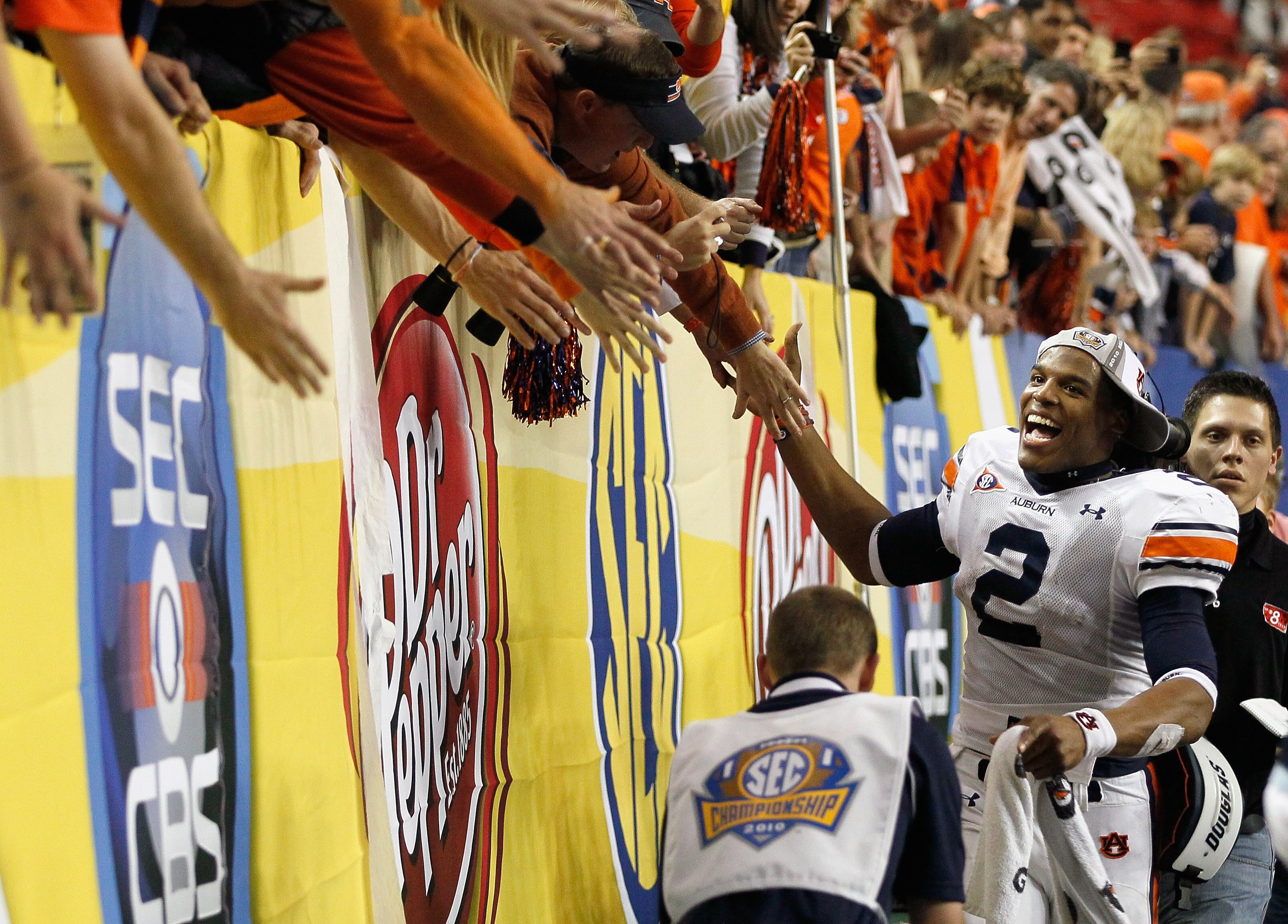 ATLANTA, GA - DECEMBER 04:  Quarterback Cam Newton #2 of the Auburn Tigers celebrates after their 56-17 win over the South Carolina Gamecocks during the 2010 SEC Championship at Georgia Dome on December 4, 2010 in Atlanta, Georgia.  (Photo by Kevin C. Cox