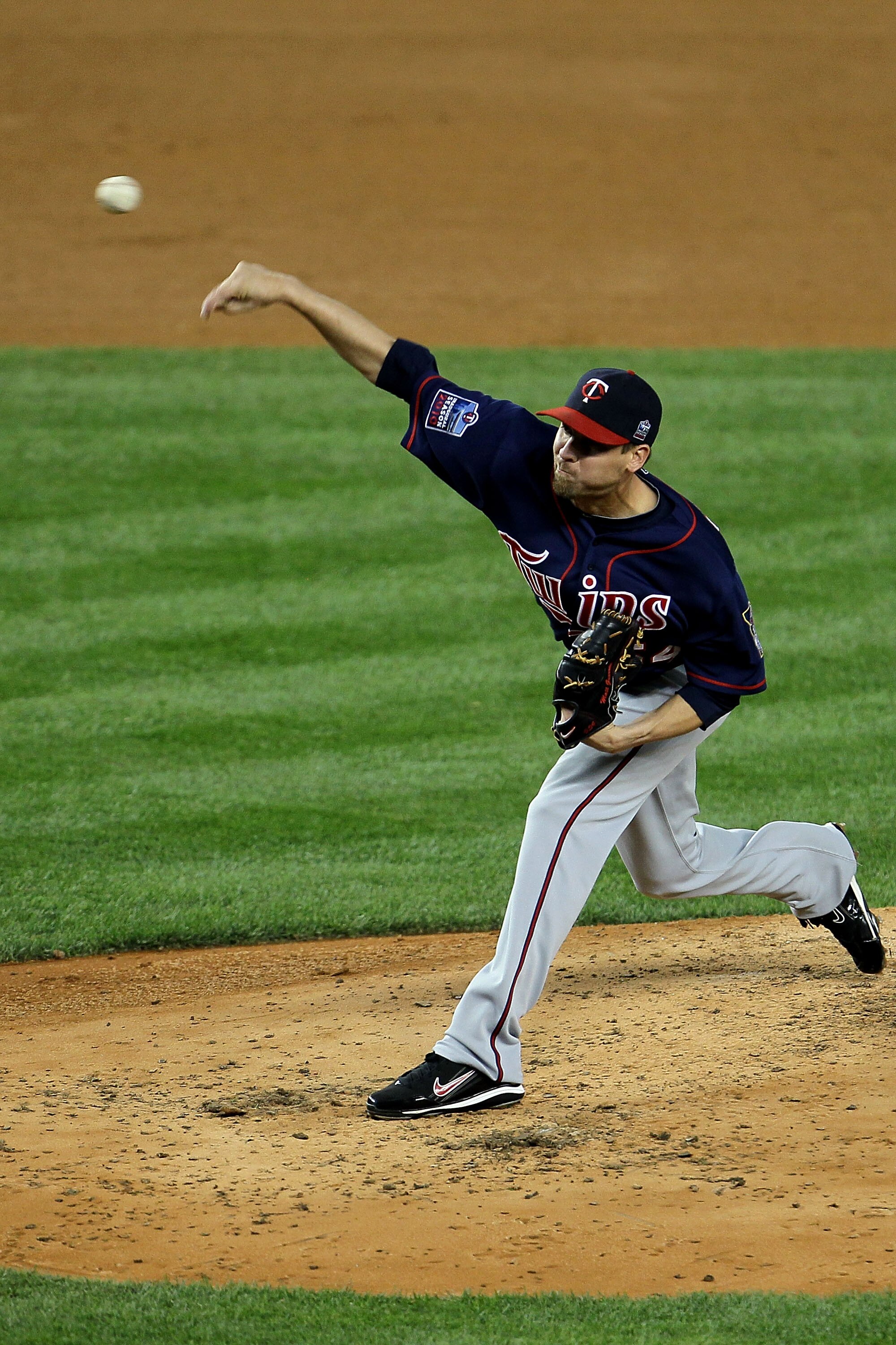 NEW YORK - OCTOBER 09:  Matt Guerrier #54 of the Minnesota Twins throws a pitch against the New York Yankees during Game Three of the ALDS part of the 2010 MLB Playoffs at Yankee Stadium on October 9, 2010 in the Bronx borough of New York City.  (Photo by