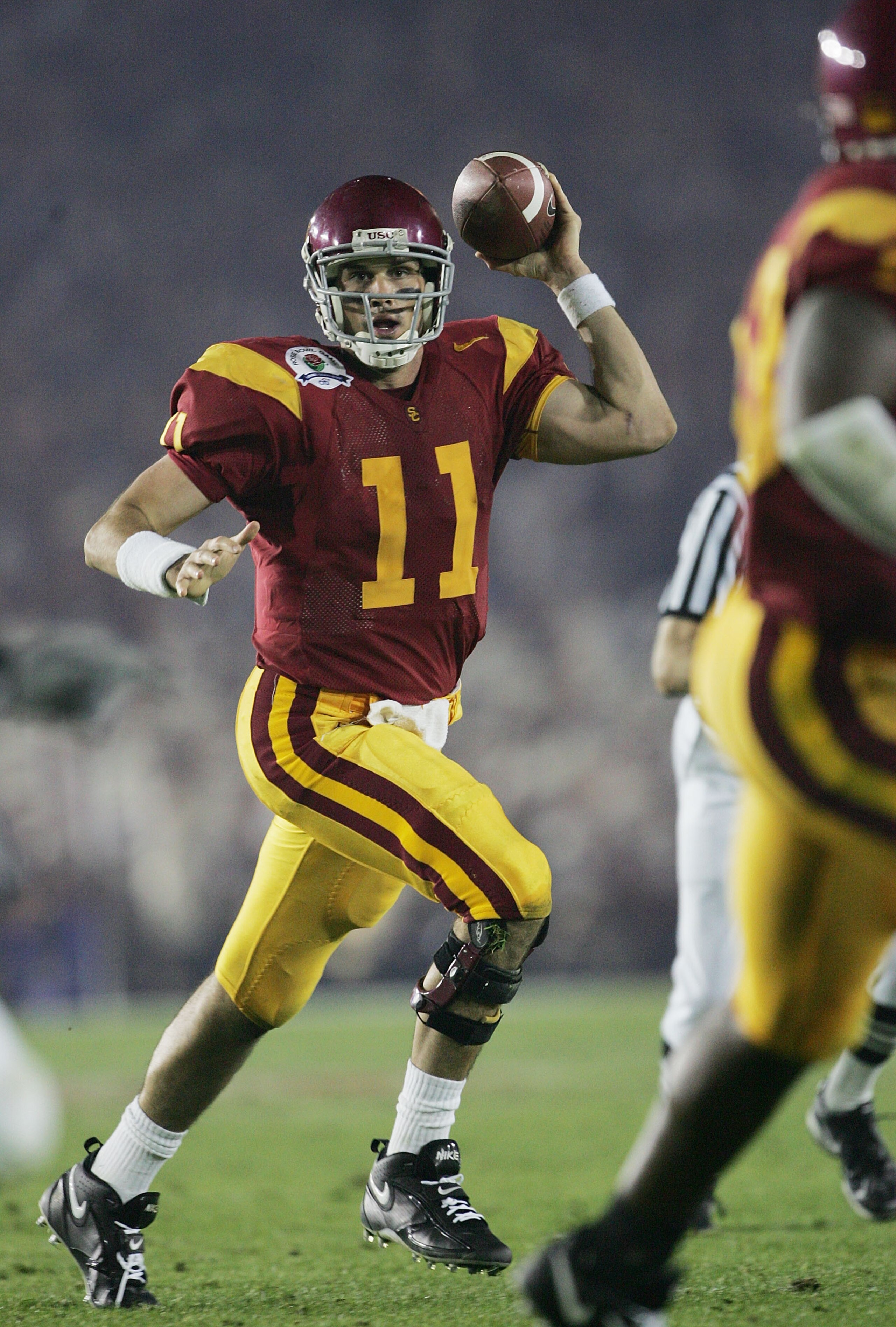 PASADENA, CA - JANUARY 04:  Quarterback Matt Leinart #11 of the USC Trojans looks for an open pass around the Texas Longhorns defense in the third quarter during the BCS National Championship Rose Bowl Game on January 4, 2006 in Pasadena, California.  (Ph