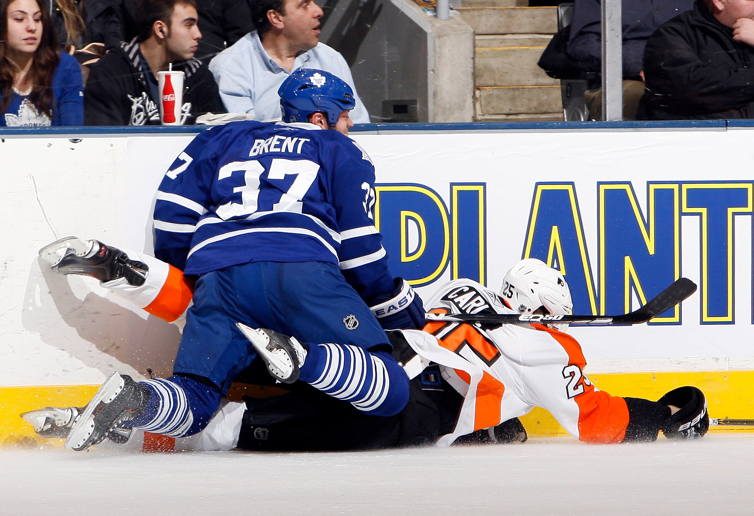 TORONTO, CANADA - DECEMBER 9: Tim Brent #37 of the Toronto Maple Leafs runs into Matt Carle #25 of the Philadelphia Flyers during game action at the Air Canada Centre December 9, 2010 in Toronto, Ontario, Canada. (Photo by Abelimages/Getty Images)