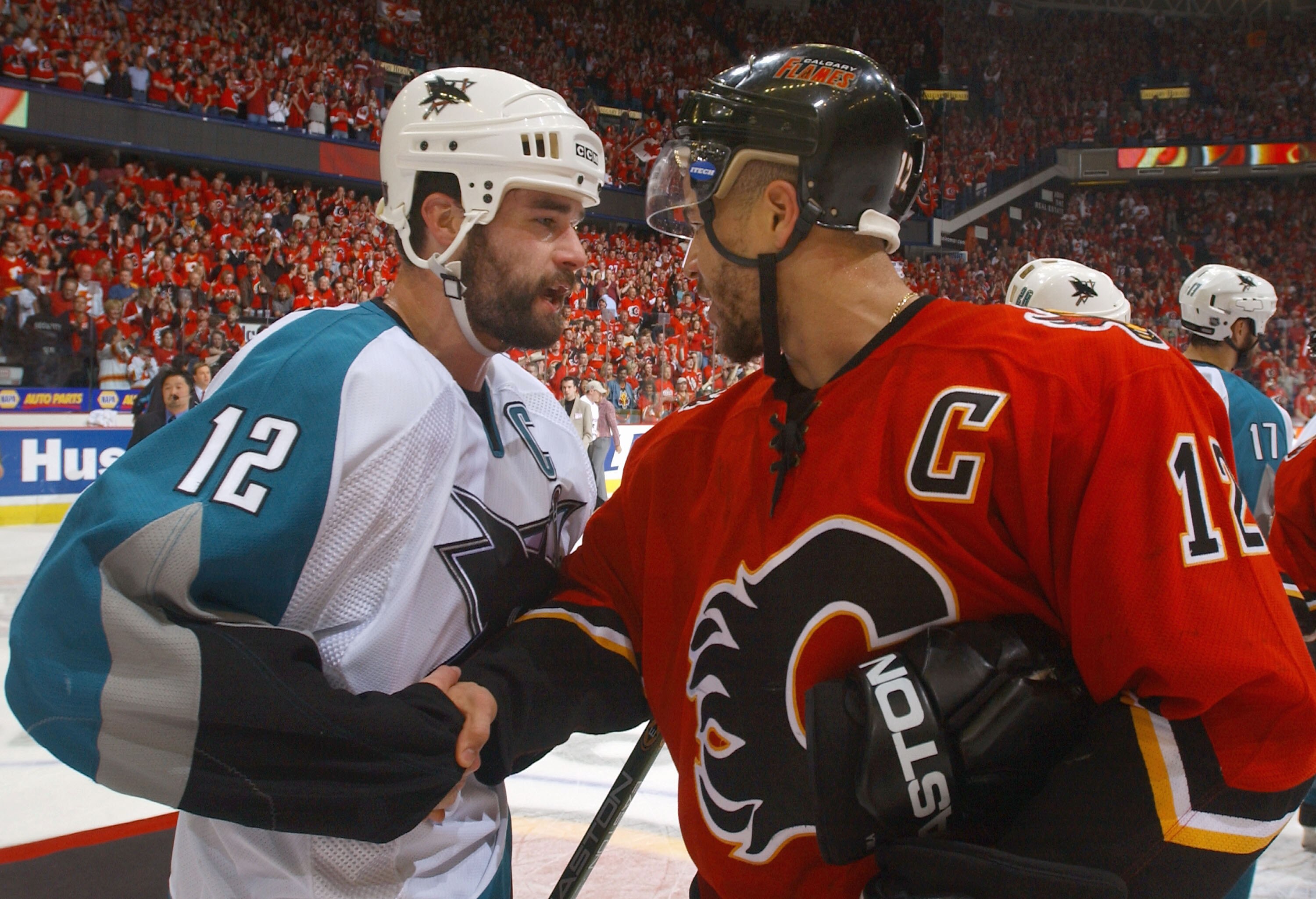 CALGARY, ALBERTA - MAY 19:  Patrick Marleau #12 of the San Jose Sharks congratulates Jarome Iginla #12 of the Calgary Flames after Game six of the 2004 NHL Western Conference Finals on May 19, 2004 at the Pengrowth Saddledome in Calgary, Alberta. The Flam