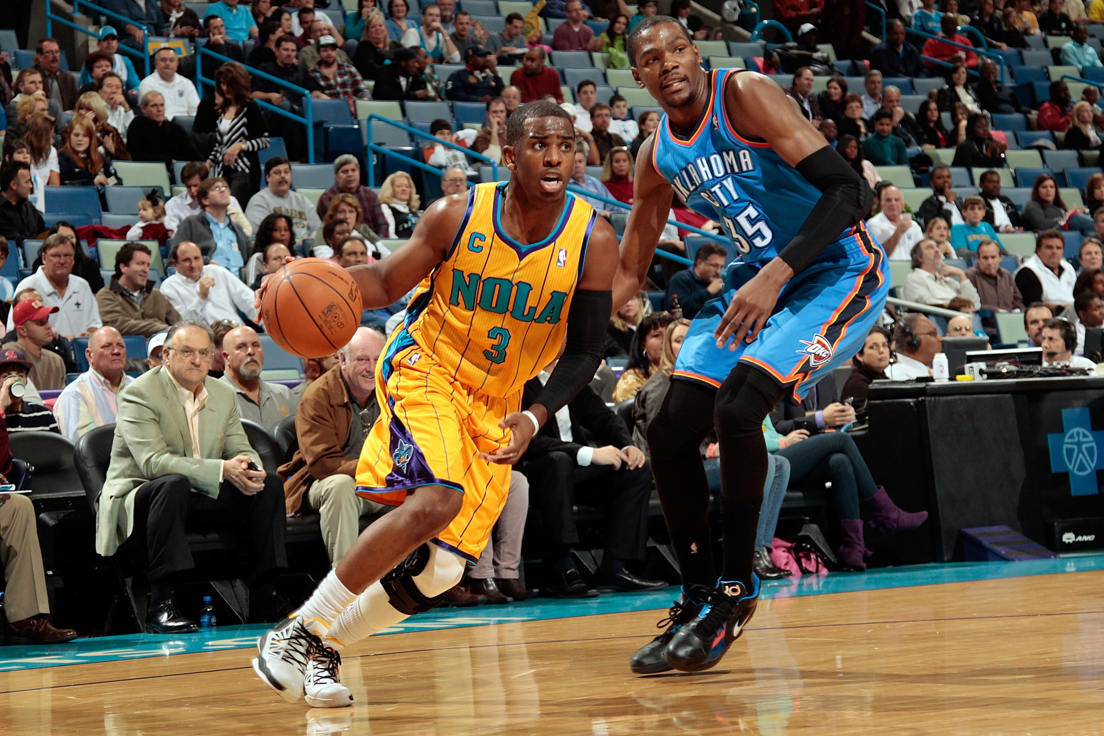 NEW ORLEANS, LA - DECEMBER 10:  Chris Paul #3 of the New Orleans Hornets drives the ball around Kevin Durant #35 of the Oklahoma City Thunder at New Orleans Arena on December 10, 2010 in New Orleans, Louisiana.    NOTE TO USER: User expressly acknowledges