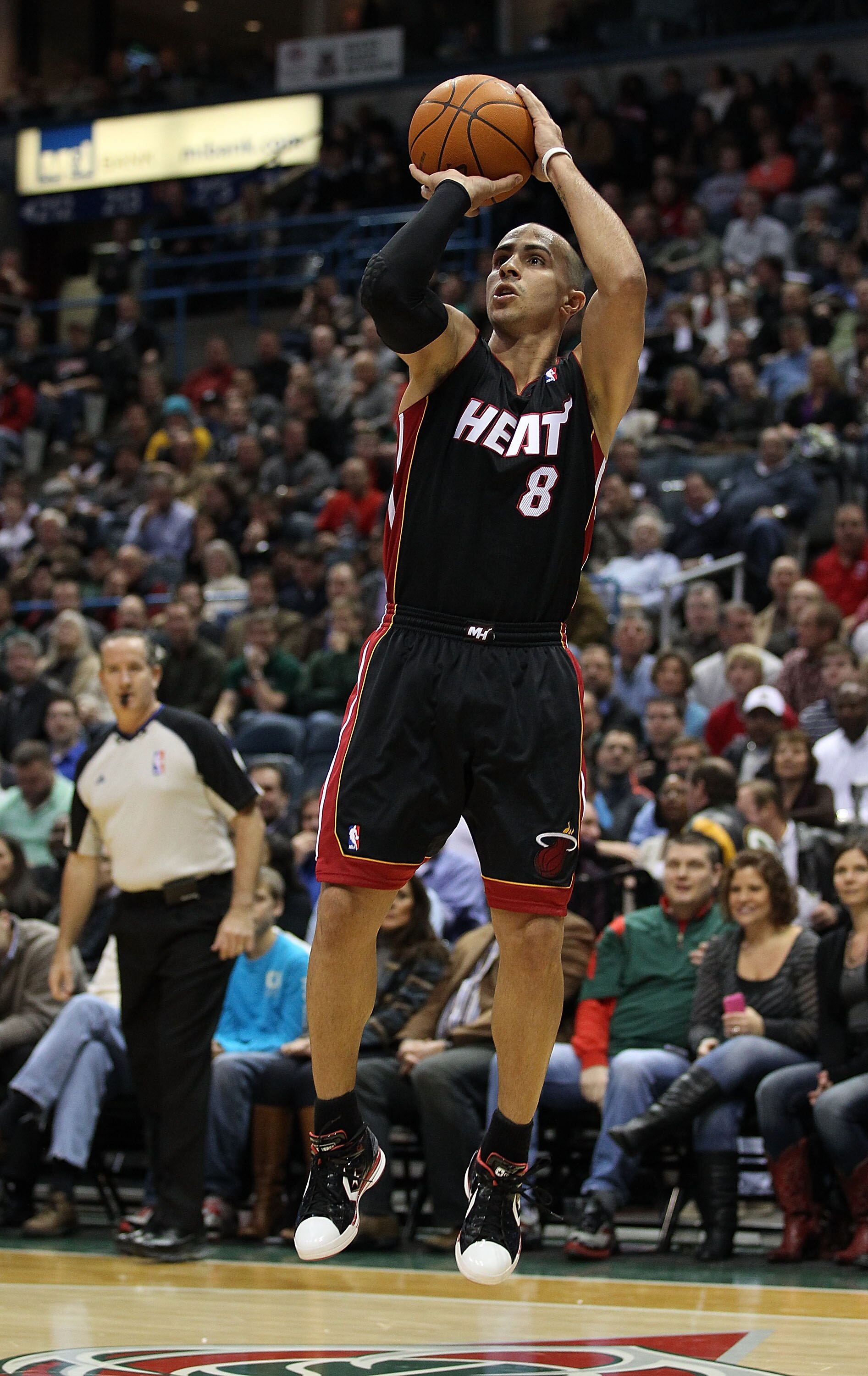 MILWAUKEE, WI - DECEMBER 06: Carlos Arroyo #8 of the Miami Heat puts up a shot against the Milwaukee Bucks at the Bradley Center on December 6, 2010 in Milwaukee, Wisconsin. The Heat defeated the Bucks 88-78. NOTE TO USER: User expressly acknowledges and