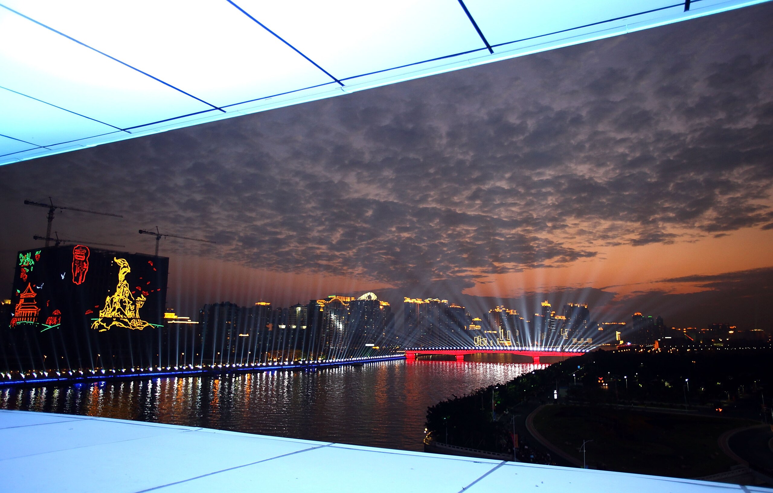 GUANGZHOU, CHINA - NOVEMBER 12: A general view of the city skyline over the Pearl River prior to the Opening Ceremony for the 16th Asian Games Guangzhou 2010 at Haixinsha Square on November 12, 2010 in Guangzhou, China. (Photo by Feng Li/Getty Images) GUANGZHOU, CHINA - NOVEMBER 12: A general view of the city skyline over the Pearl River prior to the Opening Ceremony for the 16th Asian Games Guangzhou 2010 at Haixinsha Square on November 12, 2010 in Guangzhou, China. (Photo by Feng Li/Getty Images)