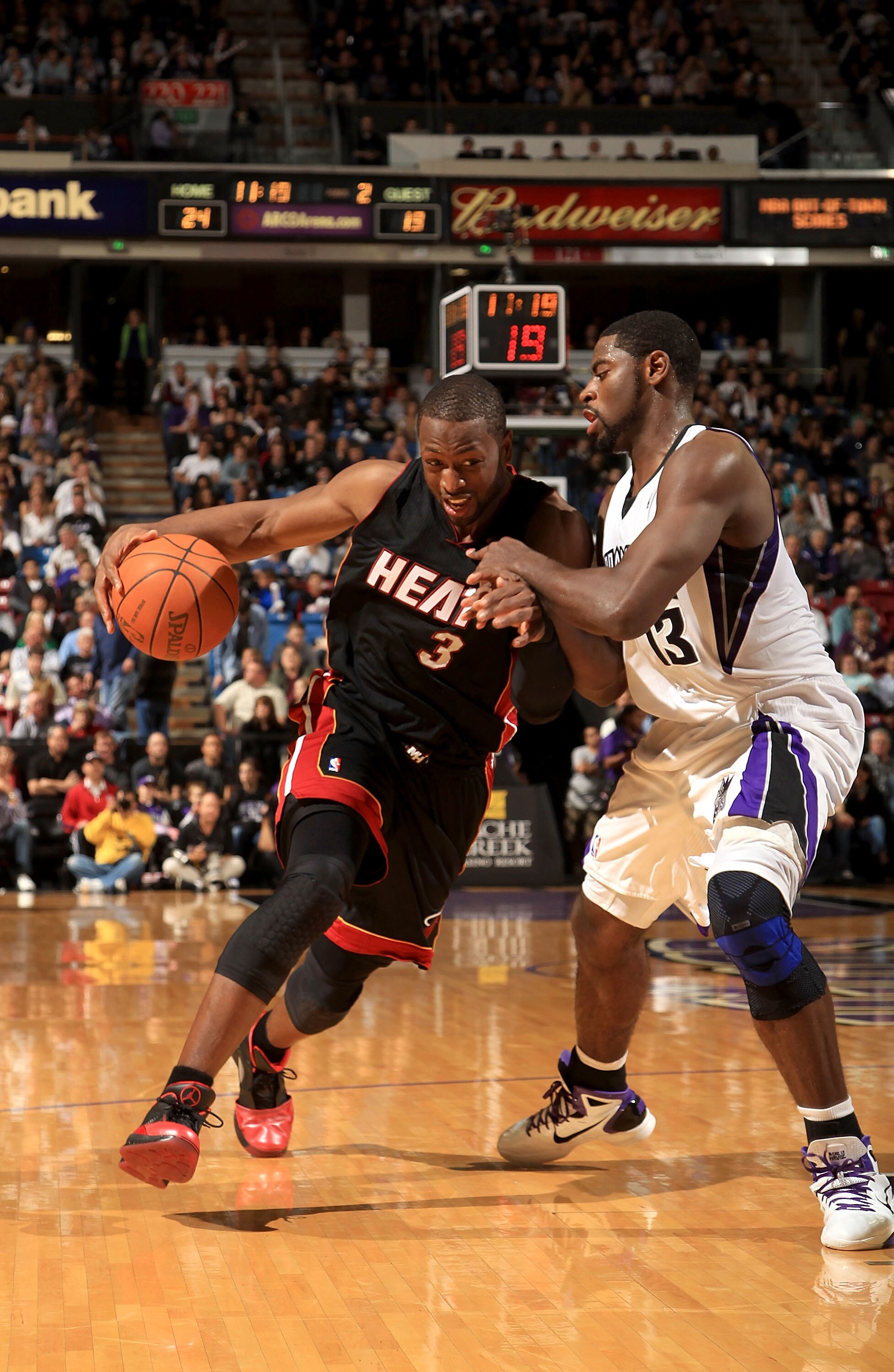 SACRAMENTO, CA - DECEMBER 11:  Dwayne Wade #3 of the Miami Heat drives on Tyreke Evans #13 of the Sacramento Kings at ARCO Arena on December 11, 2010 in Sacramento, California.  NOTE TO USER: User expressly acknowledges and agrees that, by downloading and
