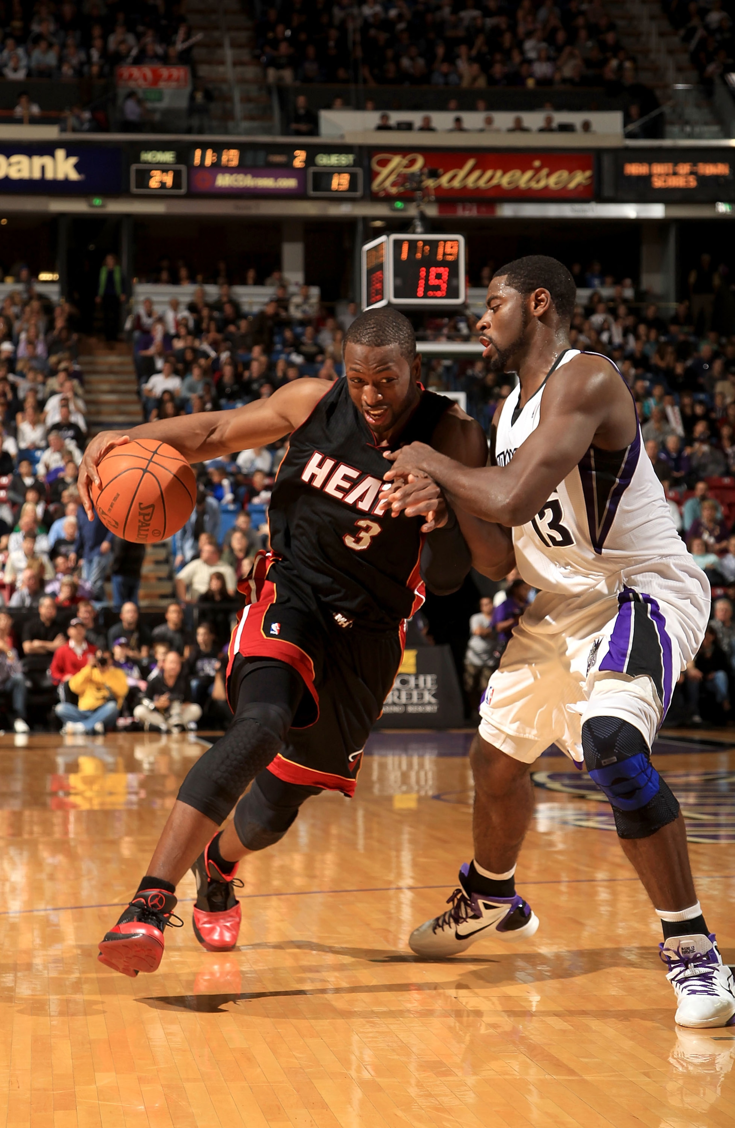 SACRAMENTO, CA - DECEMBER 11:  Dwayne Wade #3 of the Miami Heat drives on Tyreke Evans #13 of the Sacramento Kings at ARCO Arena on December 11, 2010 in Sacramento, California.  NOTE TO USER: User expressly acknowledges and agrees that, by downloading and
