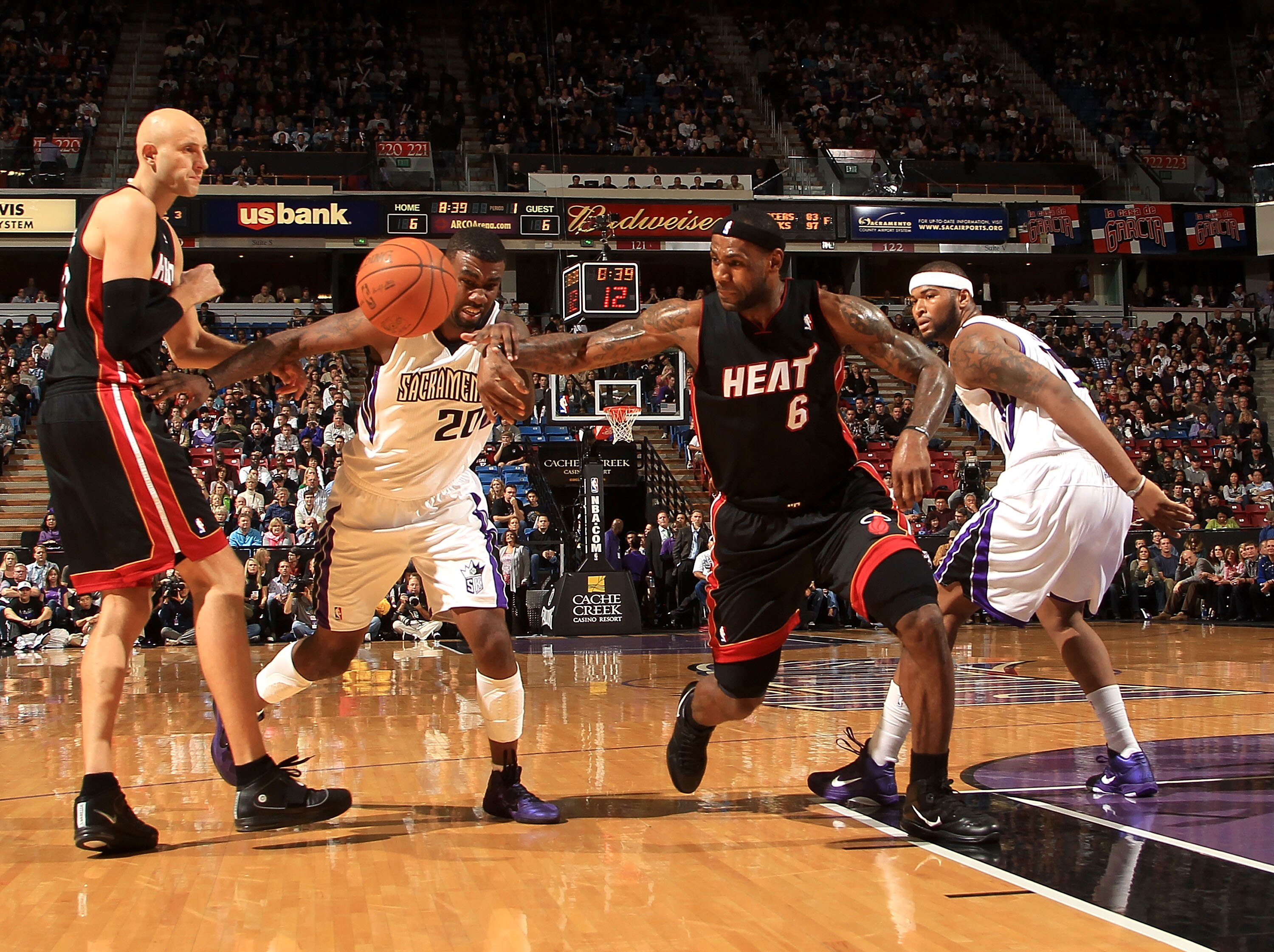 SACRAMENTO, CA - DECEMBER 11:  Lebron James #6 of the Miami Heat has the ball tipped away by Donte Greene #20 of the Sacramento Kings at ARCO Arena on December 11, 2010 in Sacramento, California.  NOTE TO USER: User expressly acknowledges and agrees that,