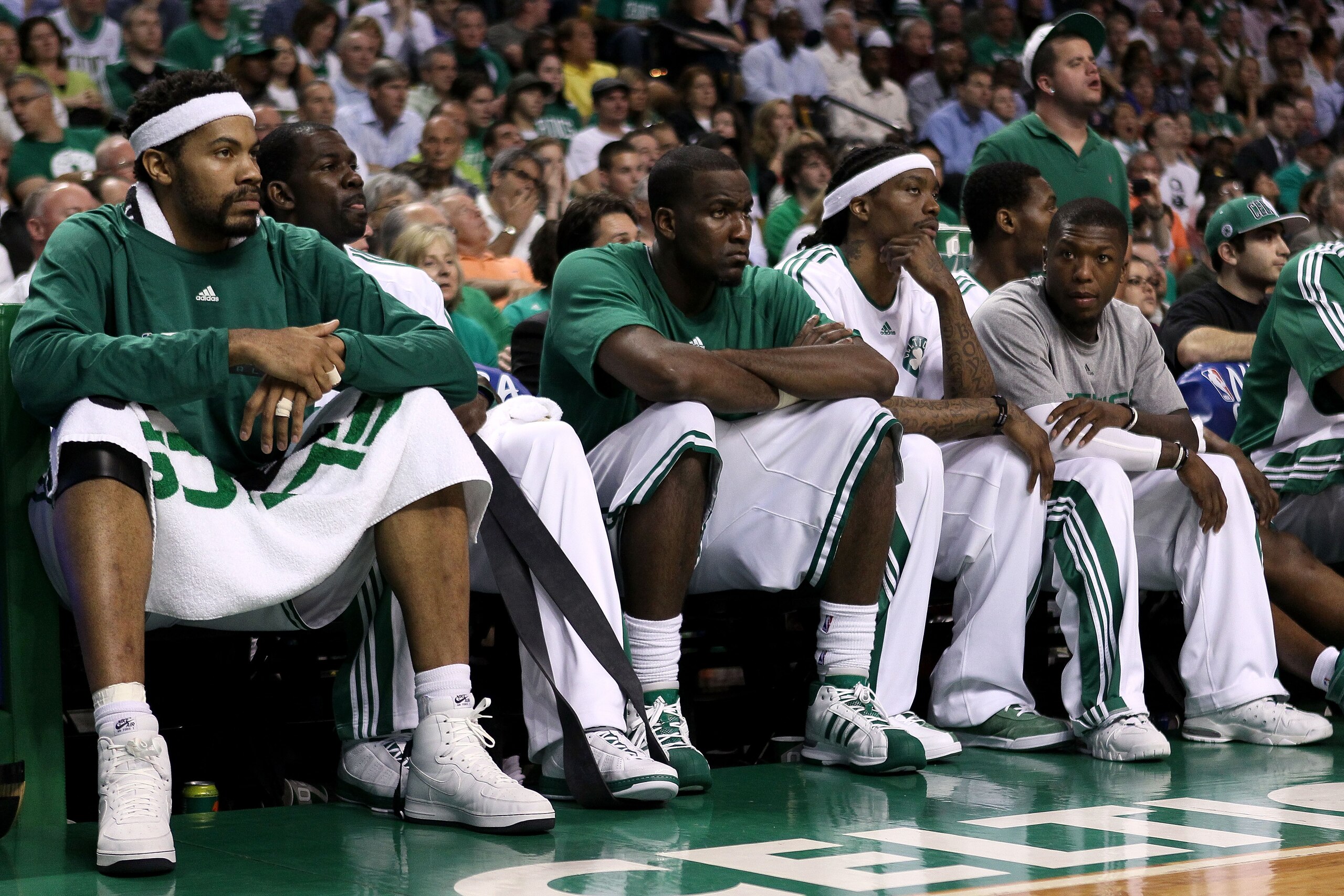 BOSTON - MAY 24:  (L-R) Rasheed Wallace #30, Michael Finley #40, Kendrick Perkins #43, Marquis Daniels and Nate Robinson #4 of the Boston Celtics look on from the bench late in the fourth quarter against the Orlando Magic in Game Four of the Eastern Confe