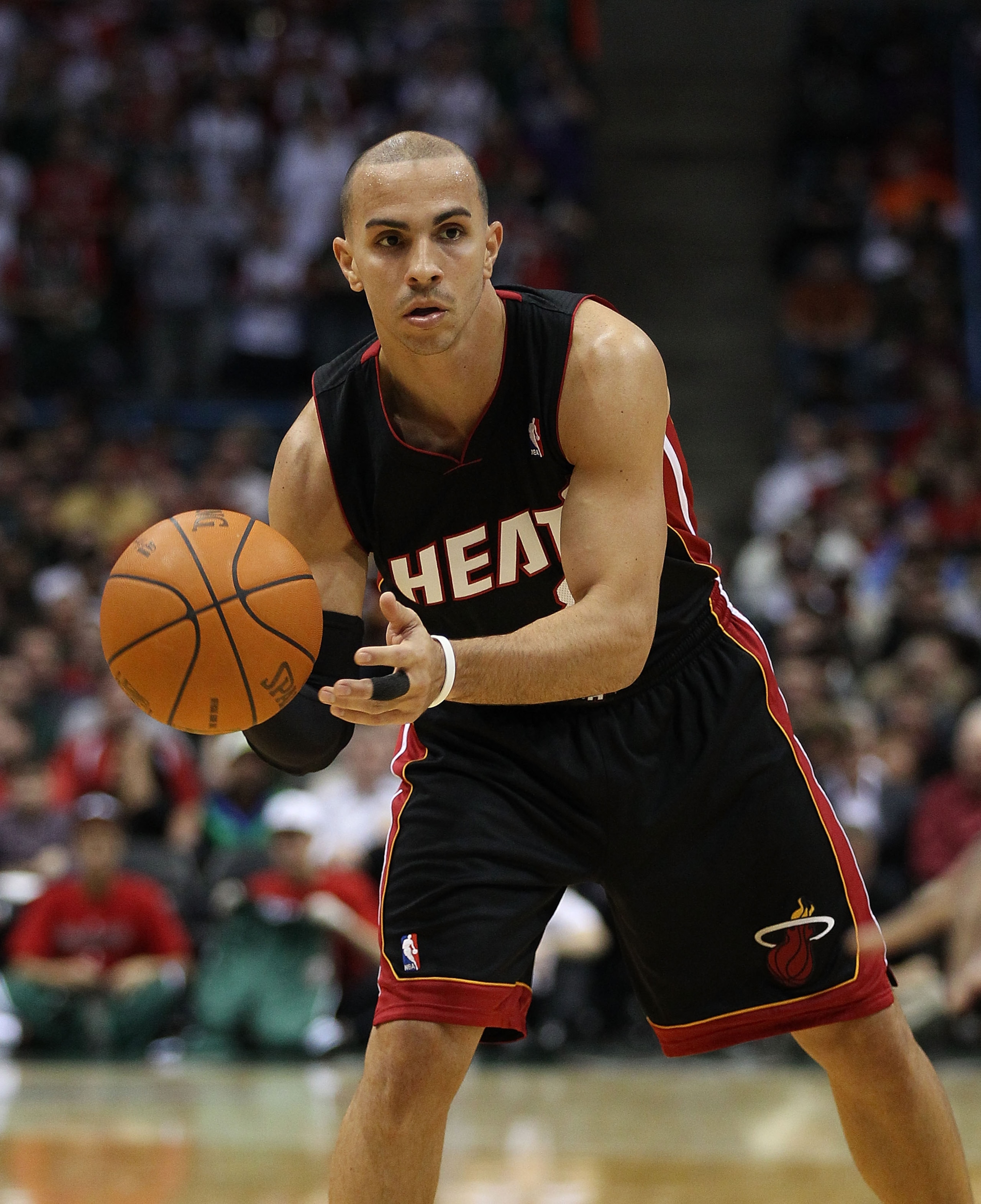 MILWAUKEE, WI - DECEMBER 06: Carlos Arroyo #8 of the Miami Heat passes the ball against the Milwaukee Bucks at the Bradley Center on December 6, 2010 in Milwaukee, Wisconsin. The Heat defeated the Bucks 88-78. NOTE TO USER: User expressly acknowledges and