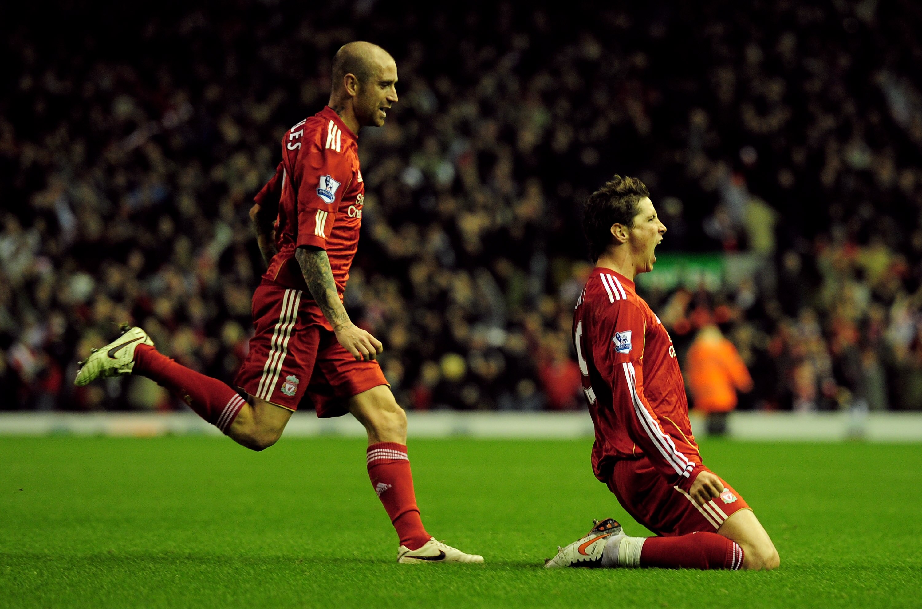 LIVERPOOL, ENGLAND - NOVEMBER 07:  Fernando Torres (R) of Liverpool celebrates scoring his team's second goal with team mate Raul Meireles during the Barclays Premier League match between Liverpool and Chelsea at Anfield on November 7, 2010 in Liverpool, 