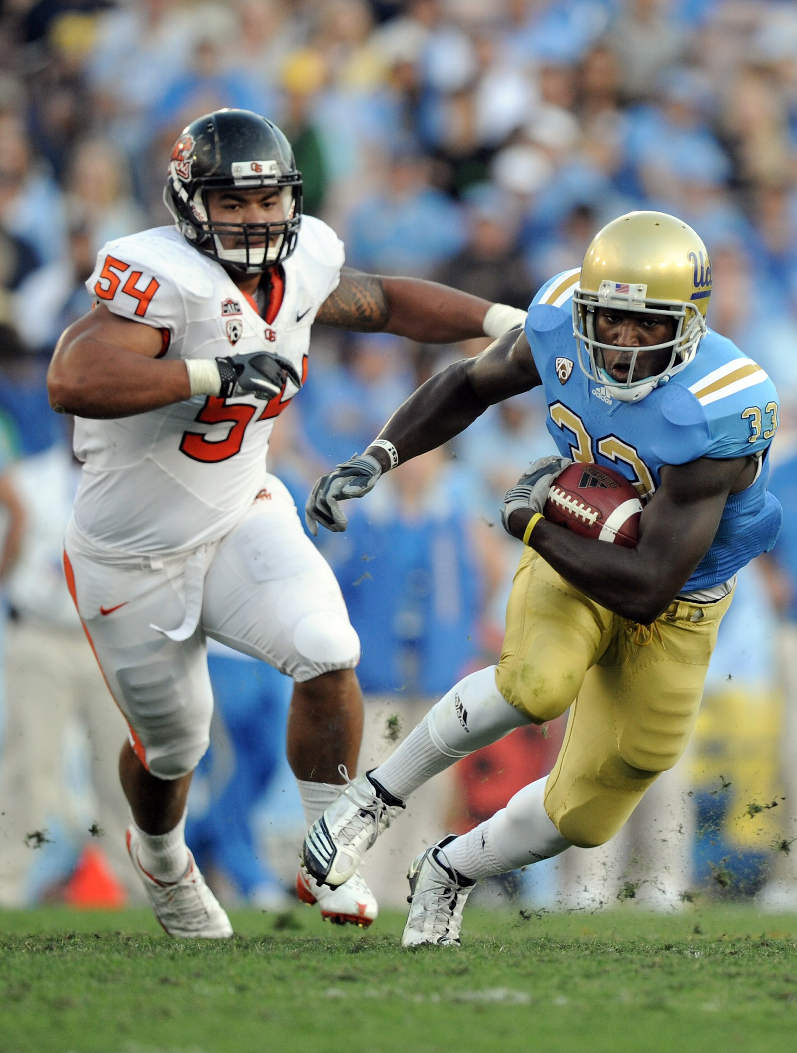 PASADENA, CA - NOVEMBER 06: Derrick Coleman #33 of the UCLA Bruins runs away from Stephen Paea #54 of the Oregon State Beavers during the second quarter at the Rose Bowl on November 6, 2010 in Pasadena, California. (Photo by Harry How/Getty Images) PASADENA, CA - NOVEMBER 06: Derrick Coleman #33 of the UCLA Bruins runs away from Stephen Paea #54 of the Oregon State Beavers during the second quarter at the Rose Bowl on November 6, 2010 in Pasadena, California. (Photo by Harry How/Getty Images)