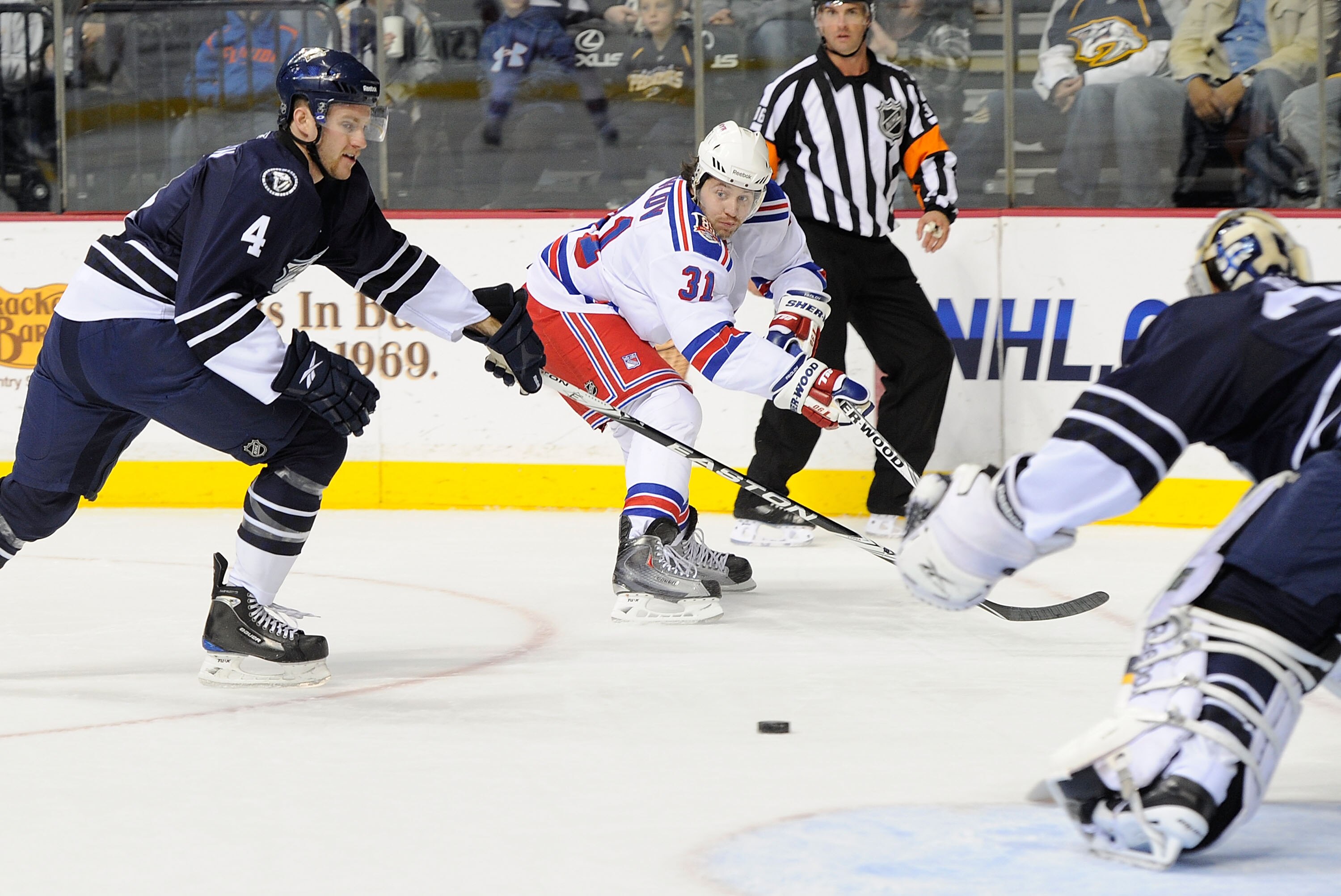NASHVILLE, TN - NOVEMBER 27:  Cody Franson #4 of the Nashville Predators watches Alex Frolov #31 of the New York Rangers take a shot on November 27, 2010 at the Bridgestone Arena in Nashville, Tennessee.  (Photo by Frederick Breedon/Getty Images)