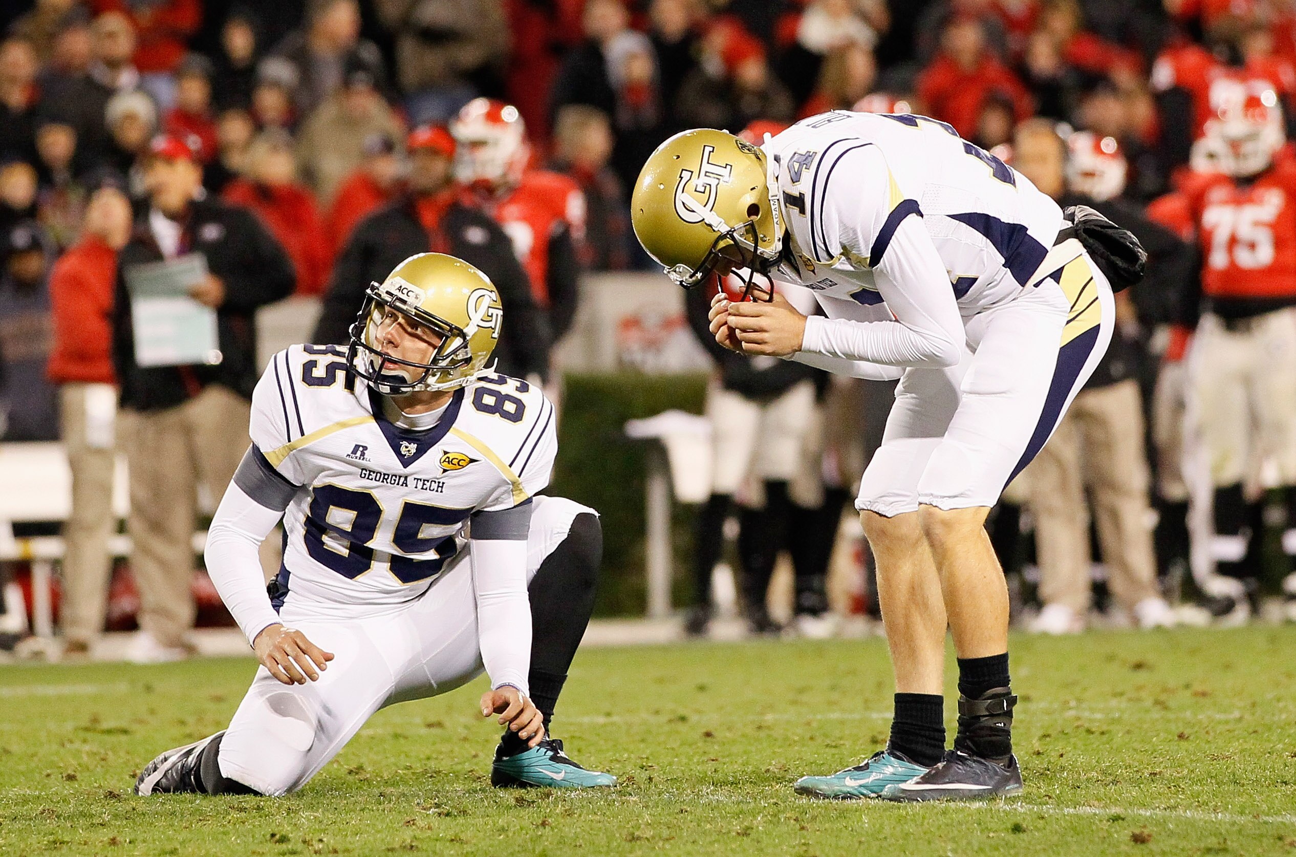 ATHENS, GA - NOVEMBER 27:  Chandler Anderson #85 of the Georgia Tech Yellow Jackets looks on as kicker Scott Blair #14 reacts after missing an extra point attempt in the fourth quarter against the Georgia Bulldogs Sanford Stadium on November 27, 2010 in A