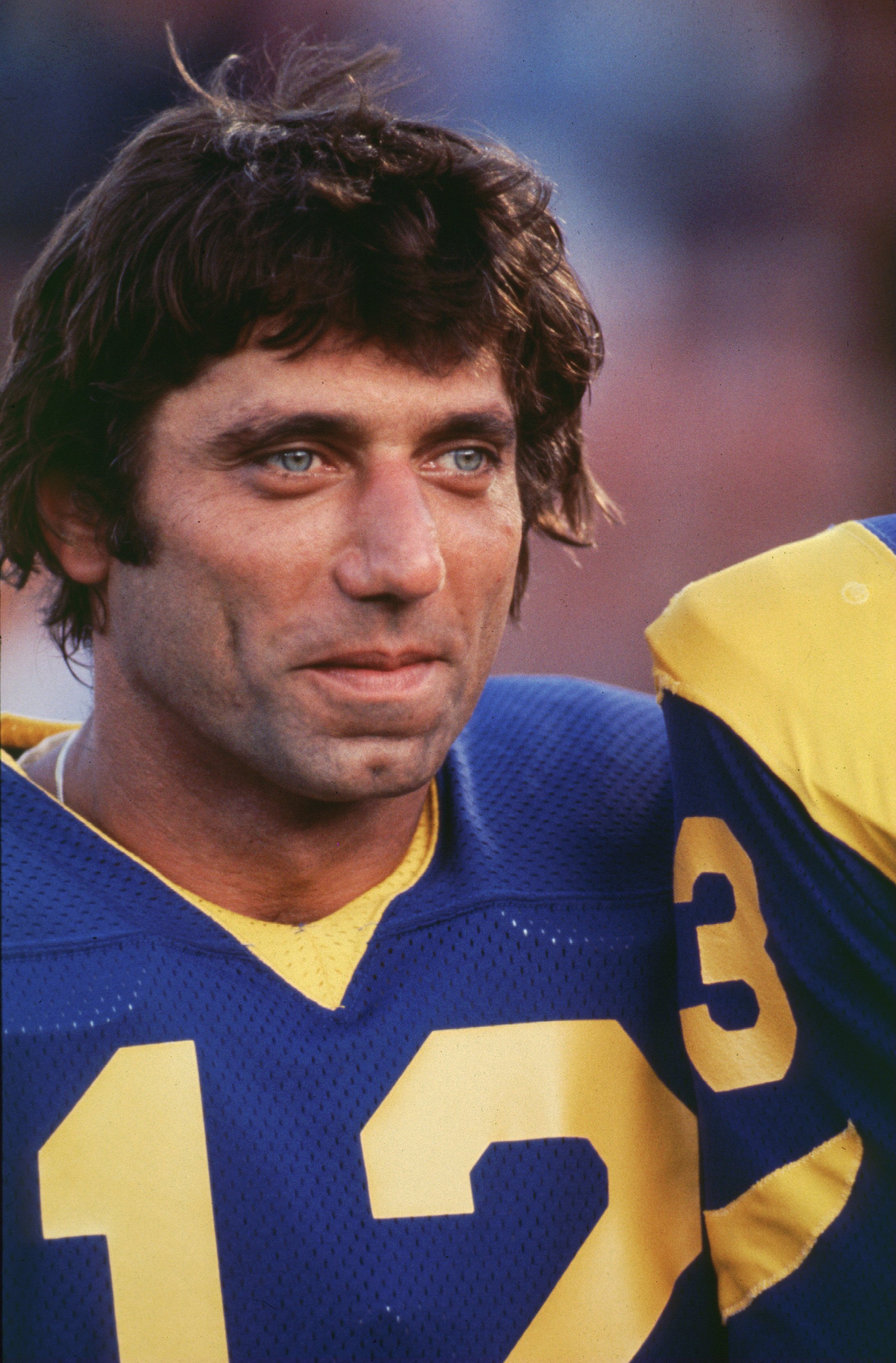 Quarterback Joe Namath of the LA Rams smiles during a game at the LA Memorial Coliseum in Los Angeles, California.