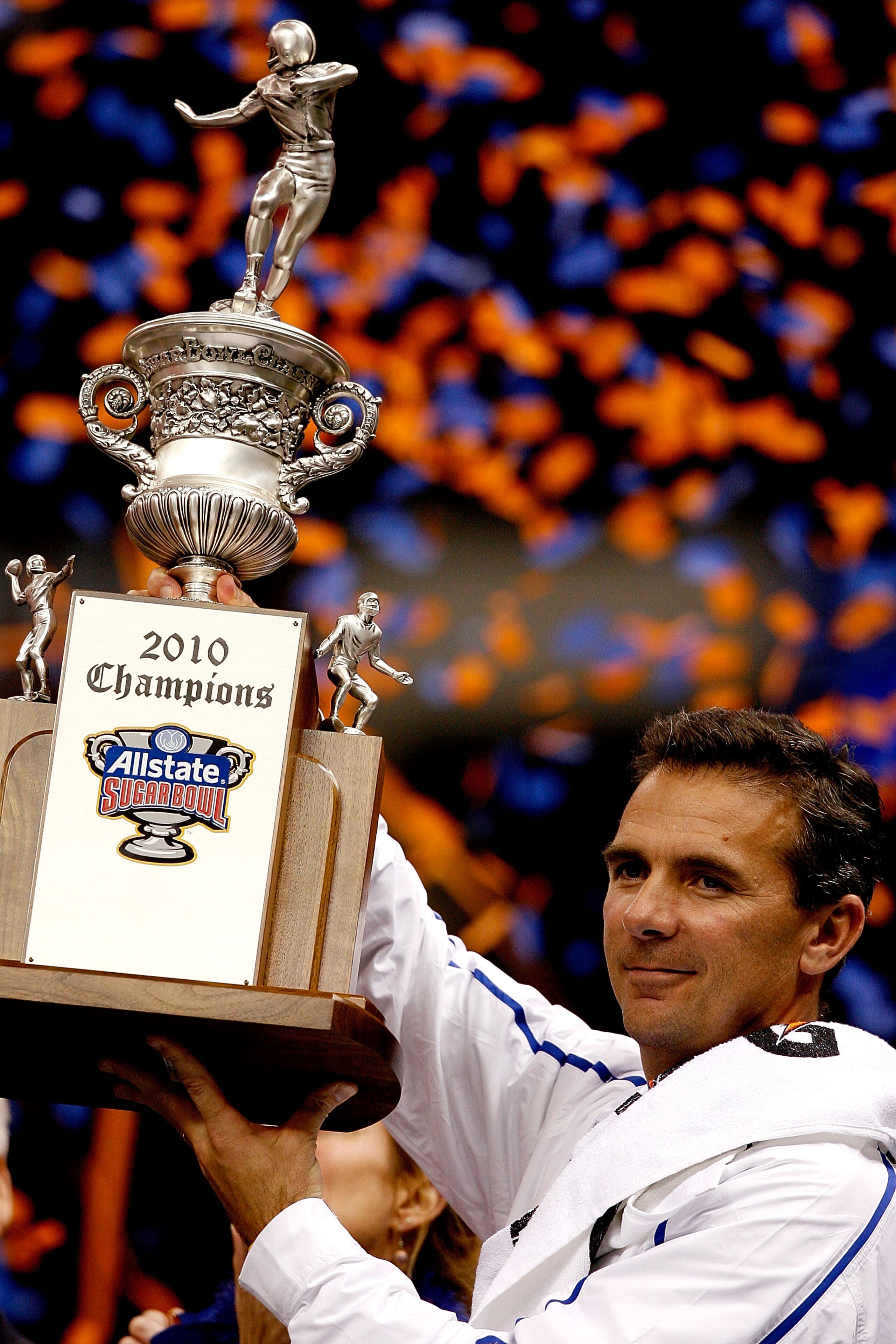 NEW ORLEANS - JANUARY 01:  Head coach Urban Meyer of the Florida Gators hoist the trophy after the Gators defeated the Cincinnati Bearcats 24-51 in the Allstate Sugar Bowl at the Louisana Superdome on January 1, 2010 in New Orleans, Louisiana.  (Photo by 