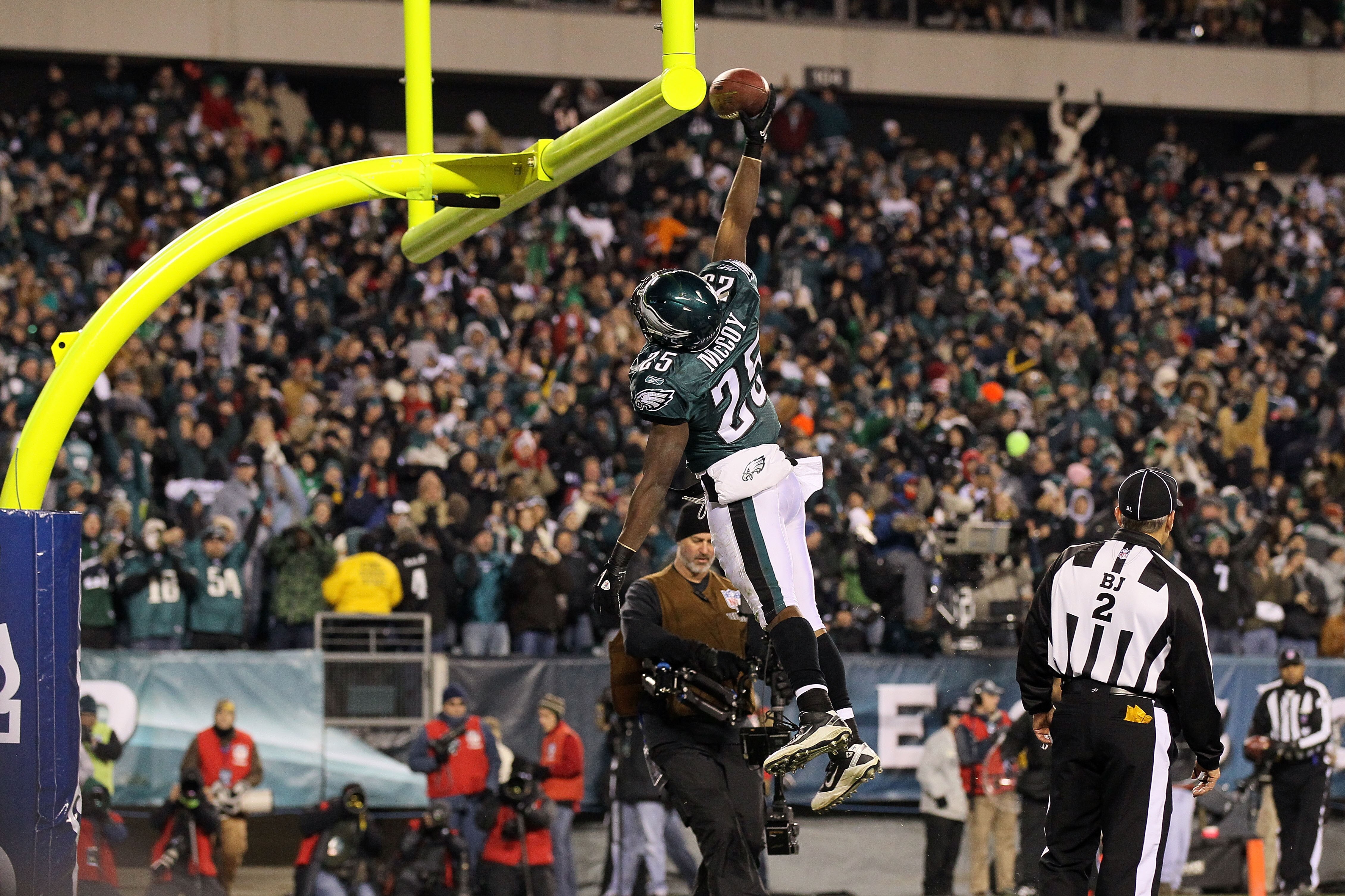 PHILADELPHIA, PA - DECEMBER 02:  Lesean Mccoy #25 of the Philadelphia Eagles dunks the ball over the goal post in celebration of scoring a 4-yard rushing touchdown in the second quarter against the Houston Texans at Lincoln Financial Field on December 2,