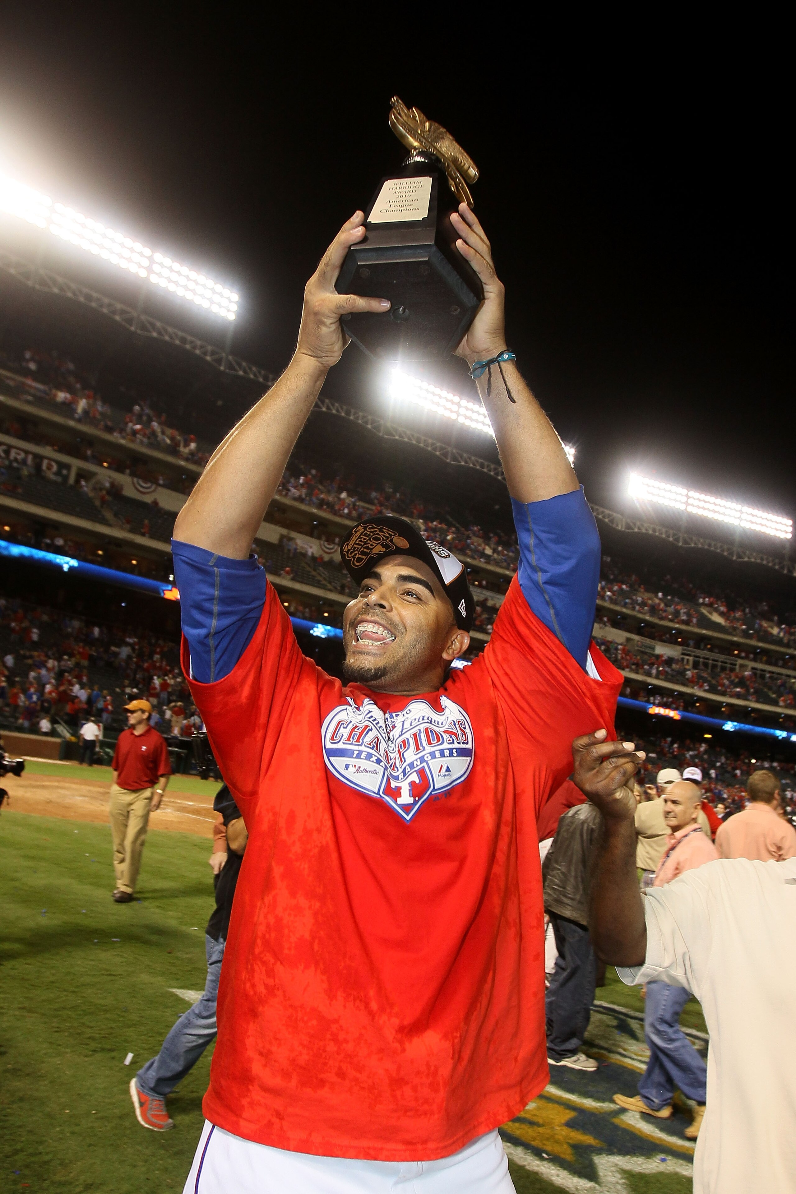 ARLINGTON, TX - OCTOBER 22:  Nelson Cruz #17 of the Texas Rangers holds the Warren C. Giles Trophy after defeating the New York Yankees 6-1 in Game Six of the ALCS to advance to the World Series during the 2010 MLB Playoffs at Rangers Ballpark in Arlingto
