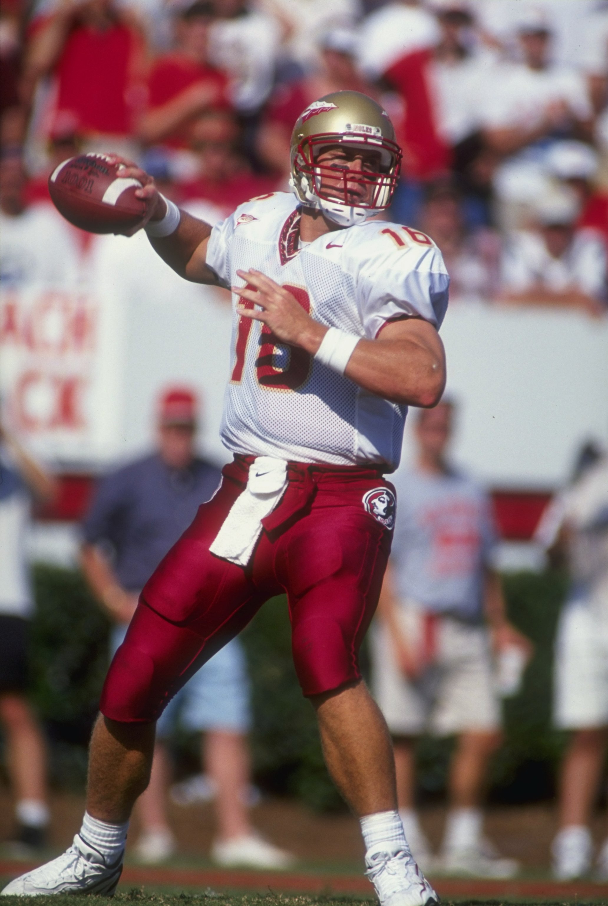 12 Sep 1998:  Quarterback Chris Weinke 16 of the Florida State University Seminals moves back to throw during the game against the North Carolina State Wolfpack at Carter Finley Stadium in Raleigh, North Carolina. North Carolina State defeated Florida Sta