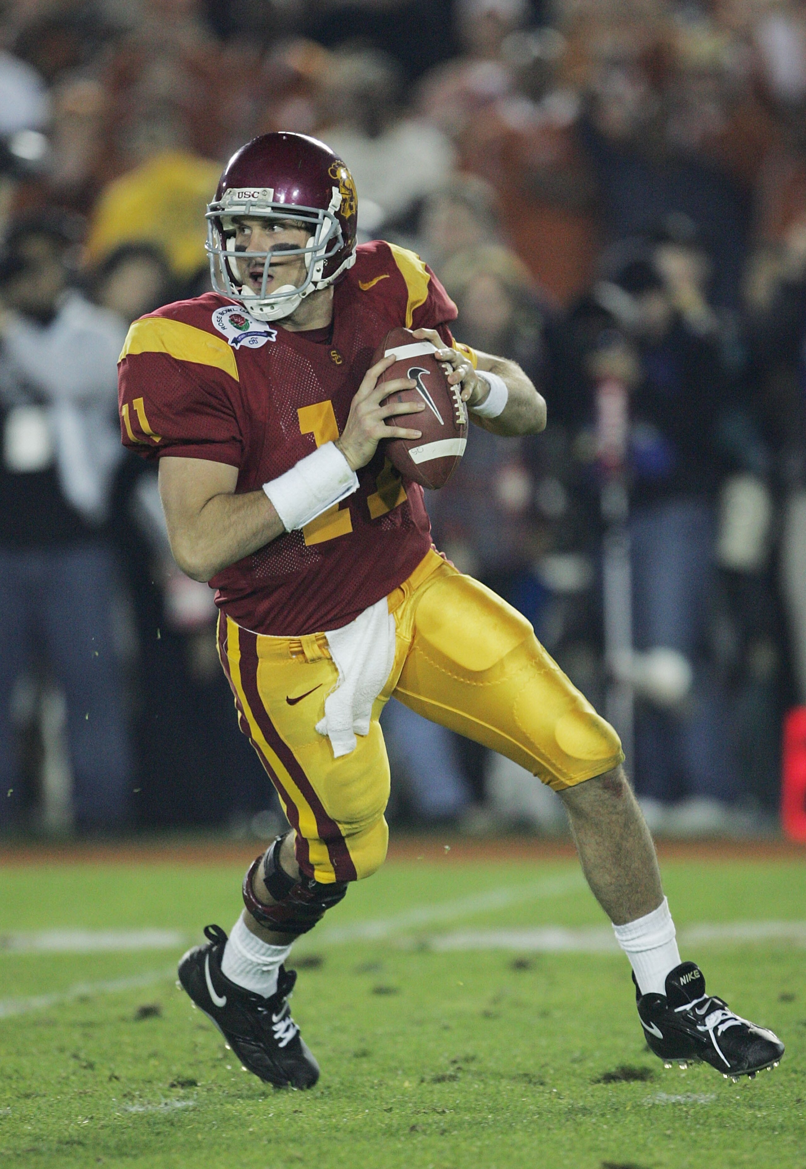 PASADENA, CA - JANUARY 04:  Quarterback Matt Leinart #11 of the USC Trojans looks for an open pass around the Texas Longhorns defense in the third quarter during the BCS National Championship Rose Bowl Game on January 4, 2006 in Pasadena, California.  (Ph