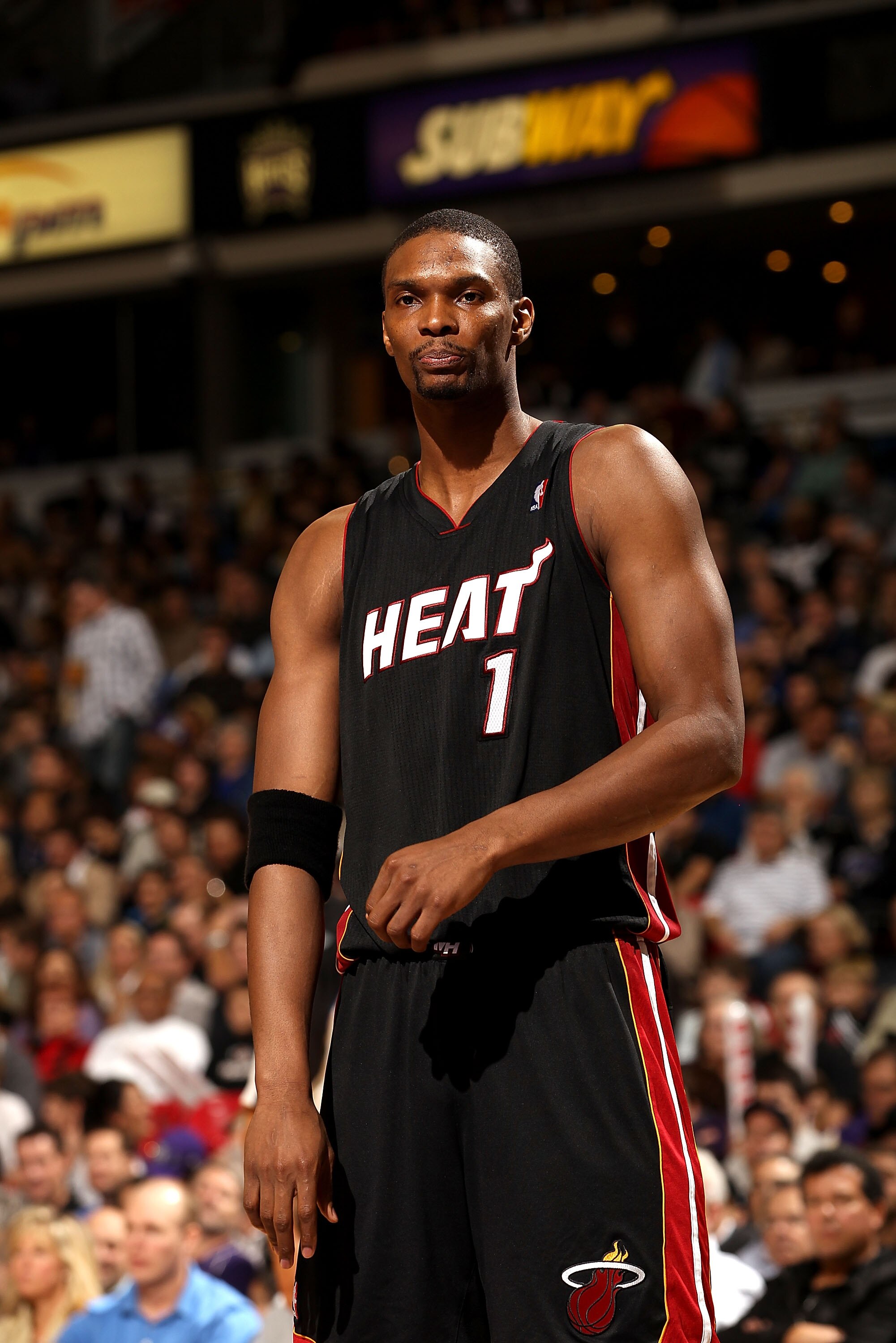 SACRAMENTO, CA - DECEMBER 11:  Chris Bosh #1 of the Miami Heat stands on to the court during their game against the Sacramento Kings at ARCO Arena on December 11, 2010 in Sacramento, California.  NOTE TO USER: User expressly acknowledges and agrees that,
