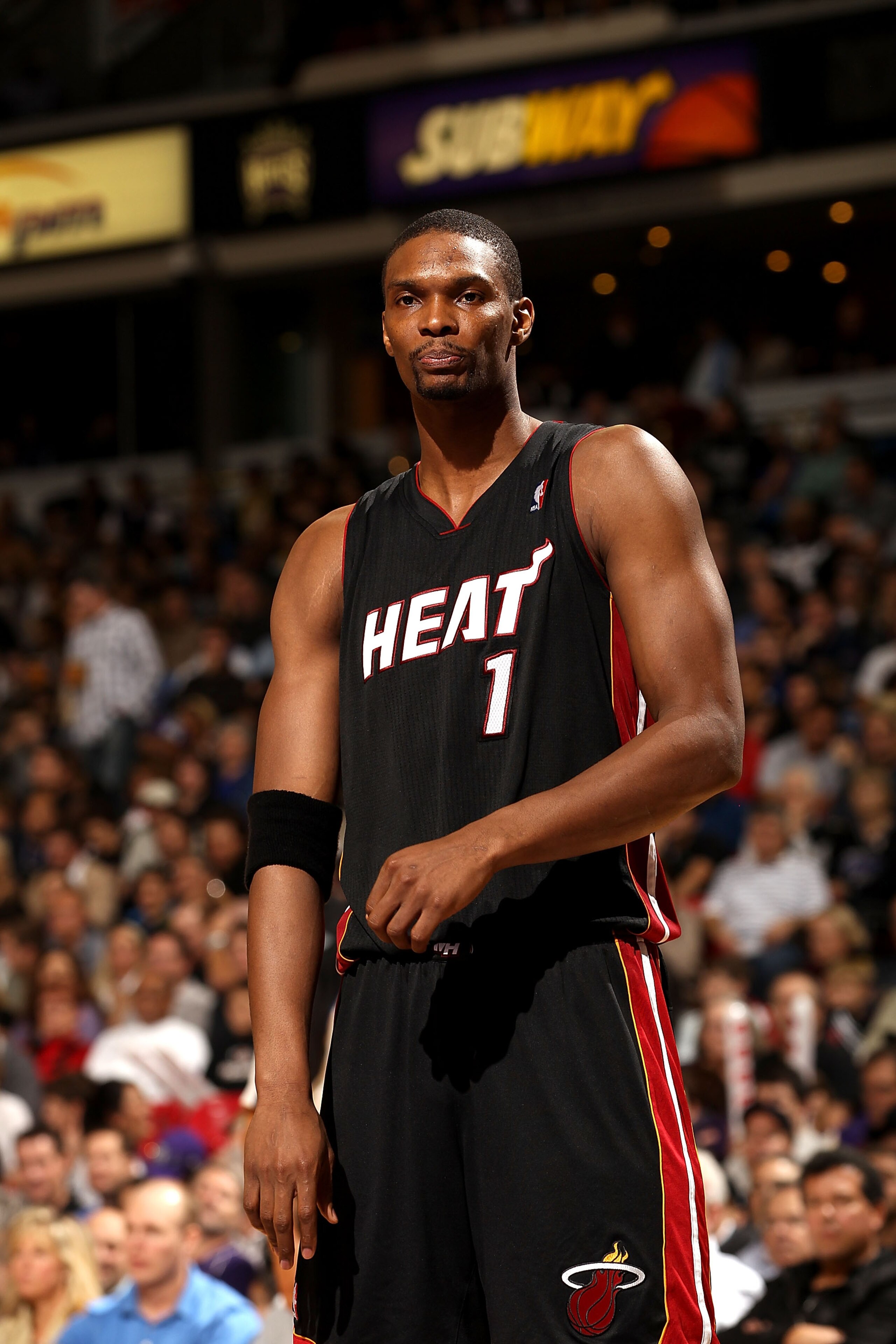 SACRAMENTO, CA - DECEMBER 11:  Chris Bosh #1 of the Miami Heat stands on to the court during their game against the Sacramento Kings at ARCO Arena on December 11, 2010 in Sacramento, California.  NOTE TO USER: User expressly acknowledges and agrees that,