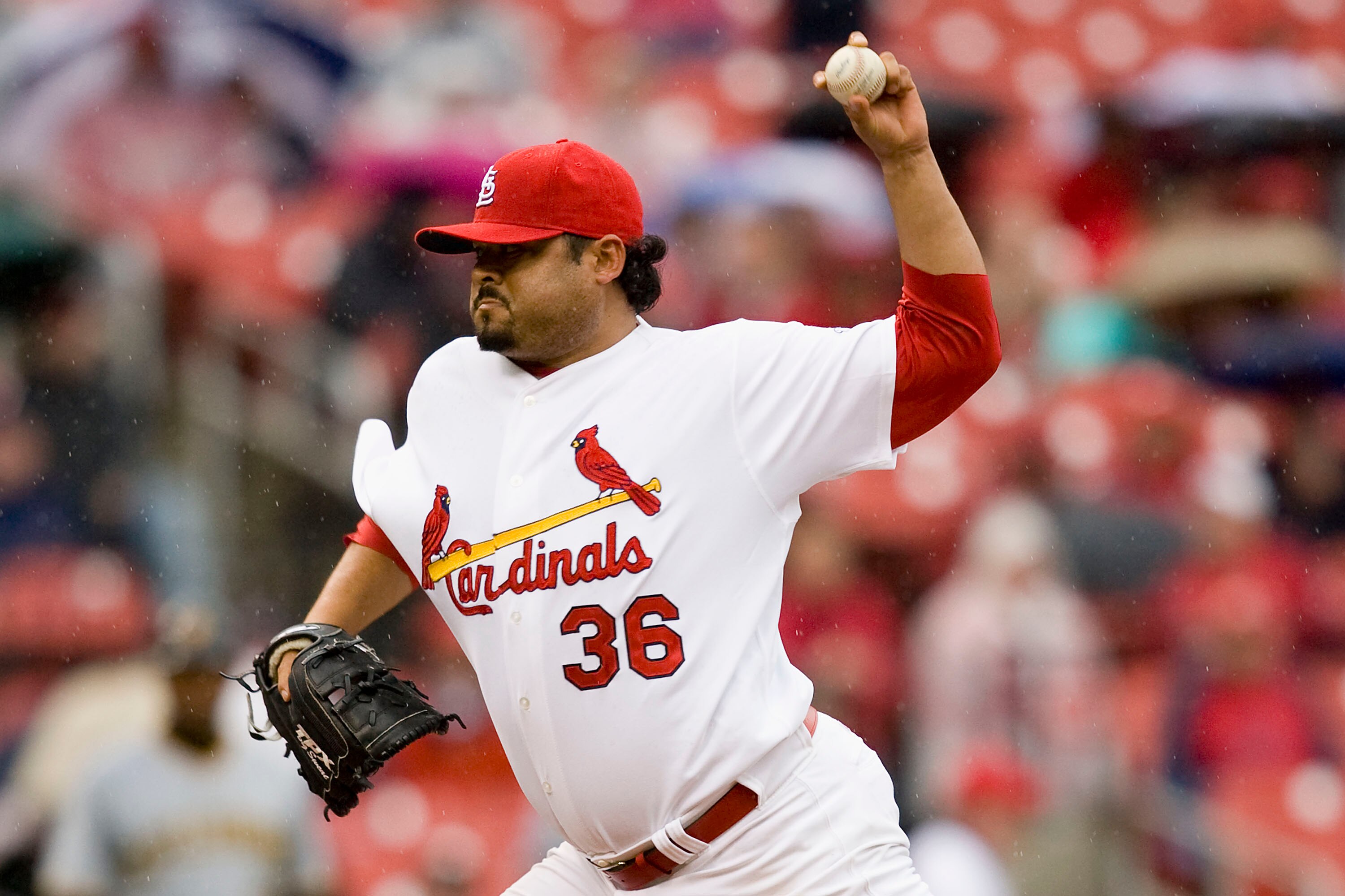 ST. LOUIS - APRIL 9:  Relief pitcher Dennys Reyes #36 of the St. Louis Cardinals throws against the Pittsburgh Pirates on April 9, 2009 at Busch Stadium in St. Louis, Missouri. The Cardinals beat the Pirates 2-1.  (Dilip Vishwanat/Getty Images)