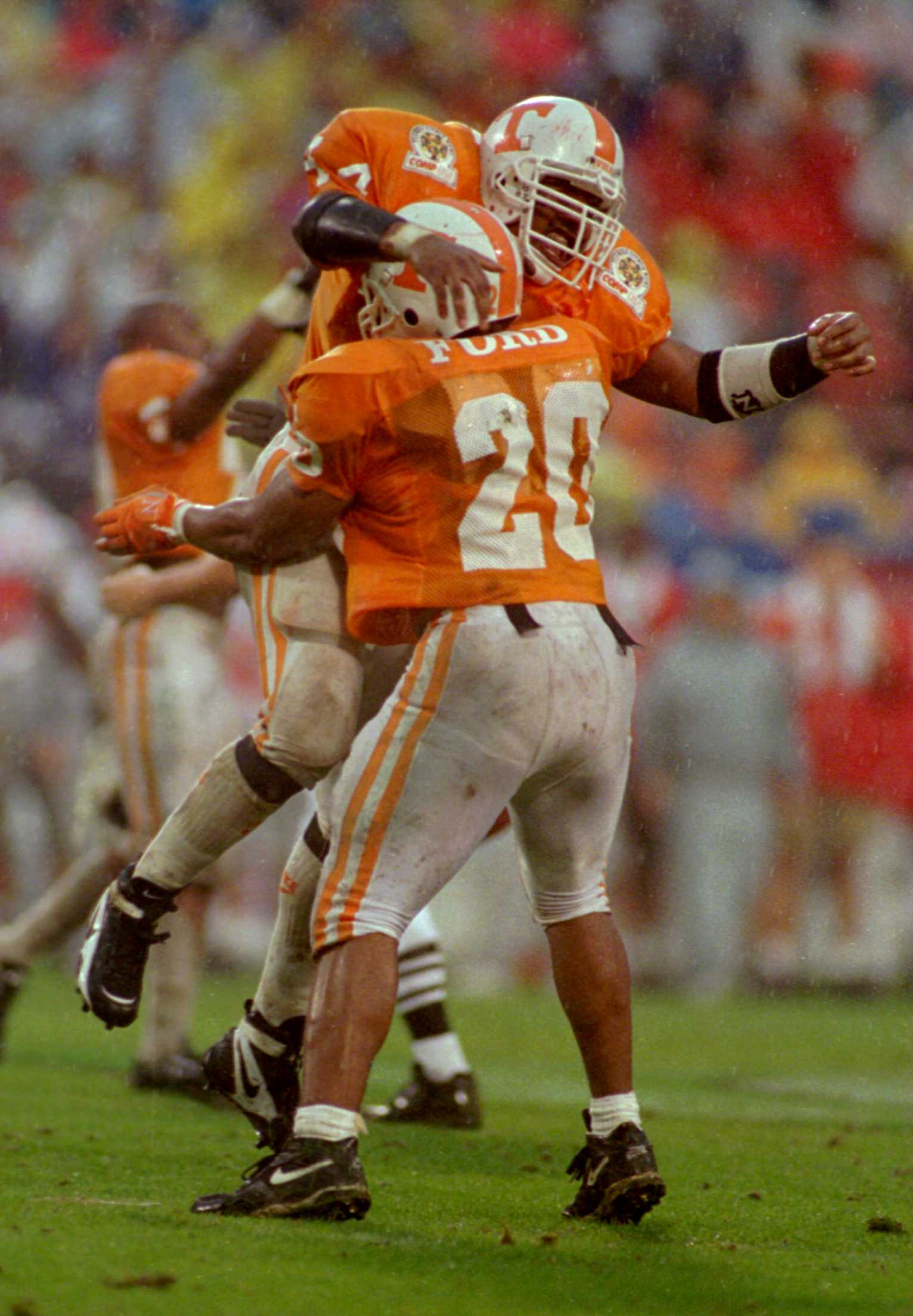 1 JAN 1996:  CRAIG KING #44 OF TENNESSEE CELEBRATES AS HE JUMPS INTO THE ARMS OF TEAMMATE CHESTER FORD #20 AFTER KING RECOVERED A FUMBLE IN THE FOURTH QUARTER OF THE COMP USA FLORIDA CITRUS BOWL AGAINST OHIO STATE AT THE CITRUS BOWL IN ORLANDO.  TENNESSEE