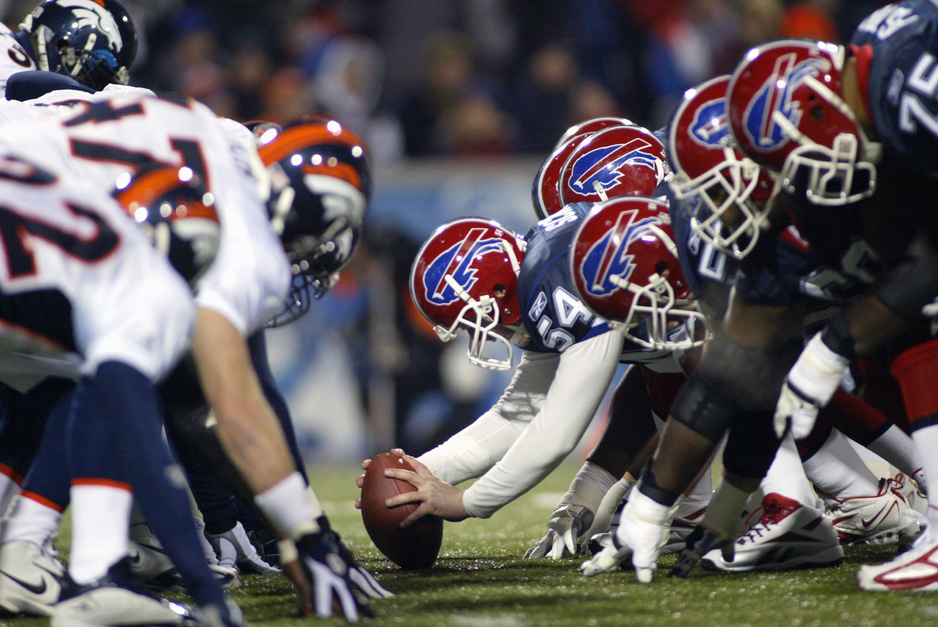 ORCHARD PARK, NY - DECEMBER 17:  Mike Schneck #54 of the Buffalo Bills is set to hike the ball during the NFL game with the Denver Broncos on December 17, 2005 at Ralph Wilson Stadium in Orchard Park, New York.  The Broncos won 35-7. (Photo by Rick Stewar