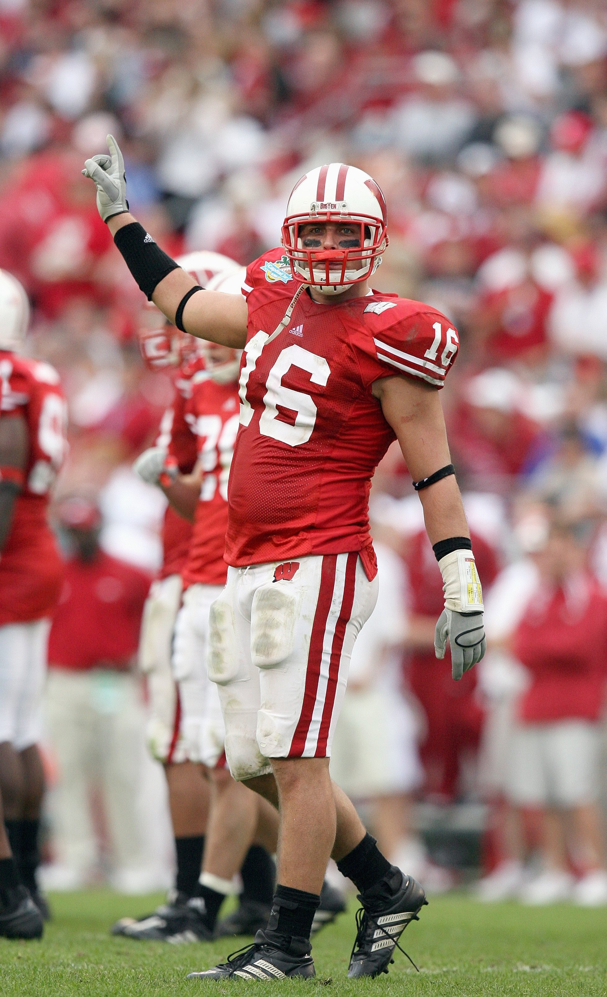 ORLANDO, FL - JANUARY 01: Joe Stellmacher #16 of the Wisconsin Badgers motions on the field against the Arkansas Razorbacks in the Capitol One Bowl at Florida Citrus Bowl on January 1, 2007 in Orlando, Florida. (Photo by Doug Benc/Getty Images)