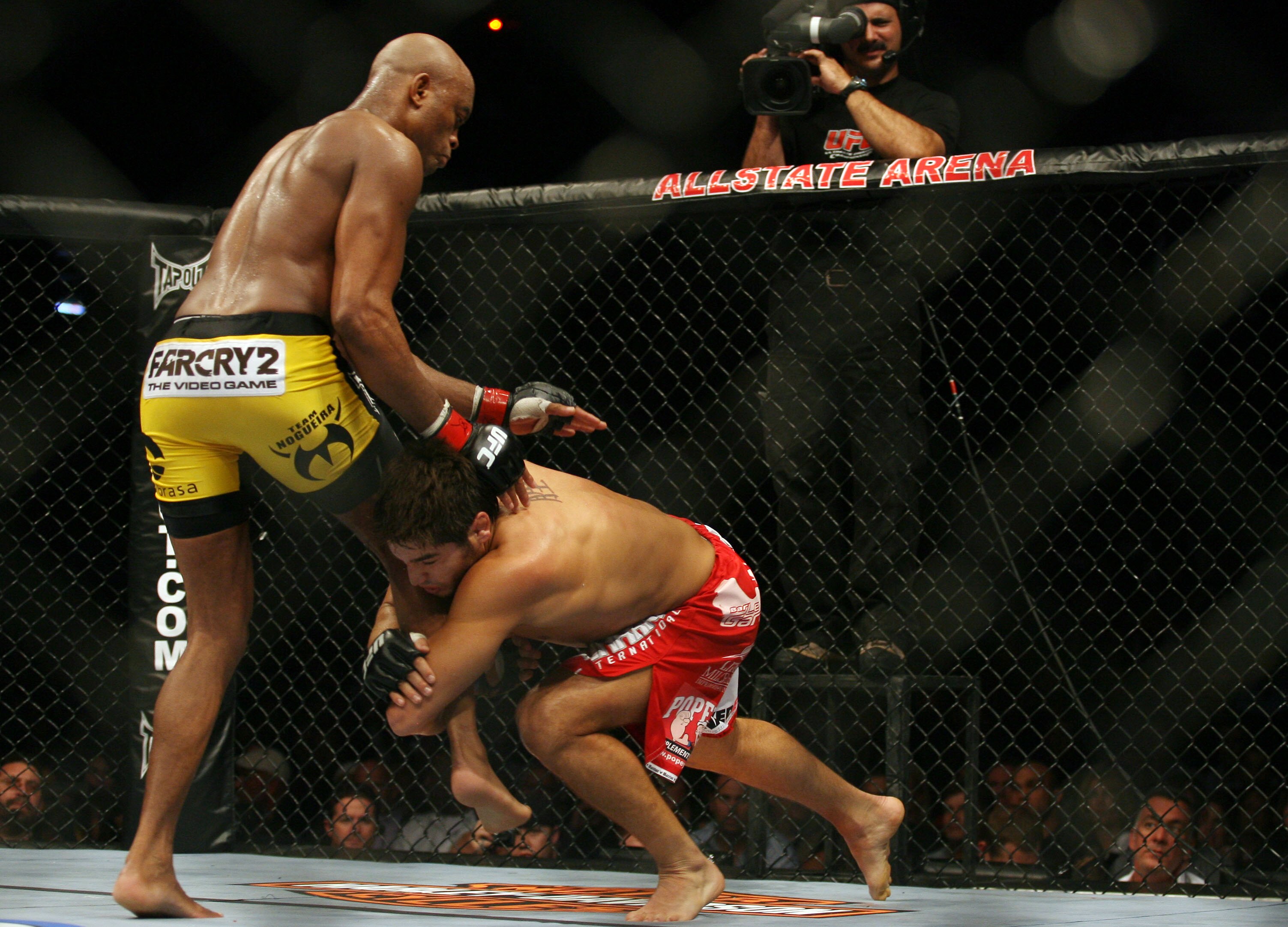 CHICAGO- OCTOBER 25: Anderson Silva (L) wrestles with Patrick Cote  in the Middleweight Title Bout at UFC's Ultimate Fight Night at Allstate Arena on October 25, 2008 in Chicago, Illinois. (Photo by Tasos Katopodis/Getty Images)