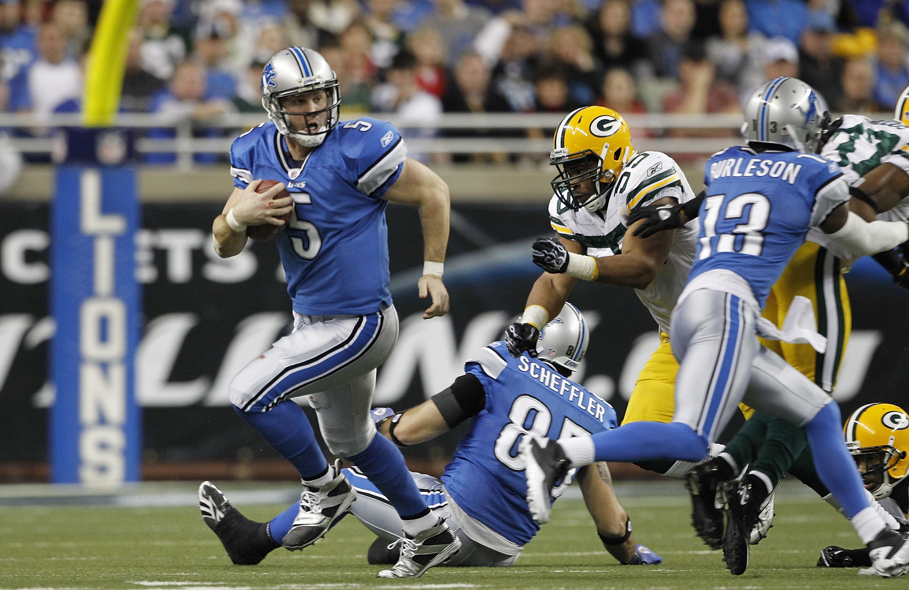 DETROIT - DECEMBER 12:  Drew Stanton #5 of the Detroit Lions runs for a first down during the the game against the Green Bay Packers at Ford Field on December 12, 2010 in Detroit, Michigan. The Lions defeated the Packers 7-3.  (Photo by Leon Halip/Getty I
