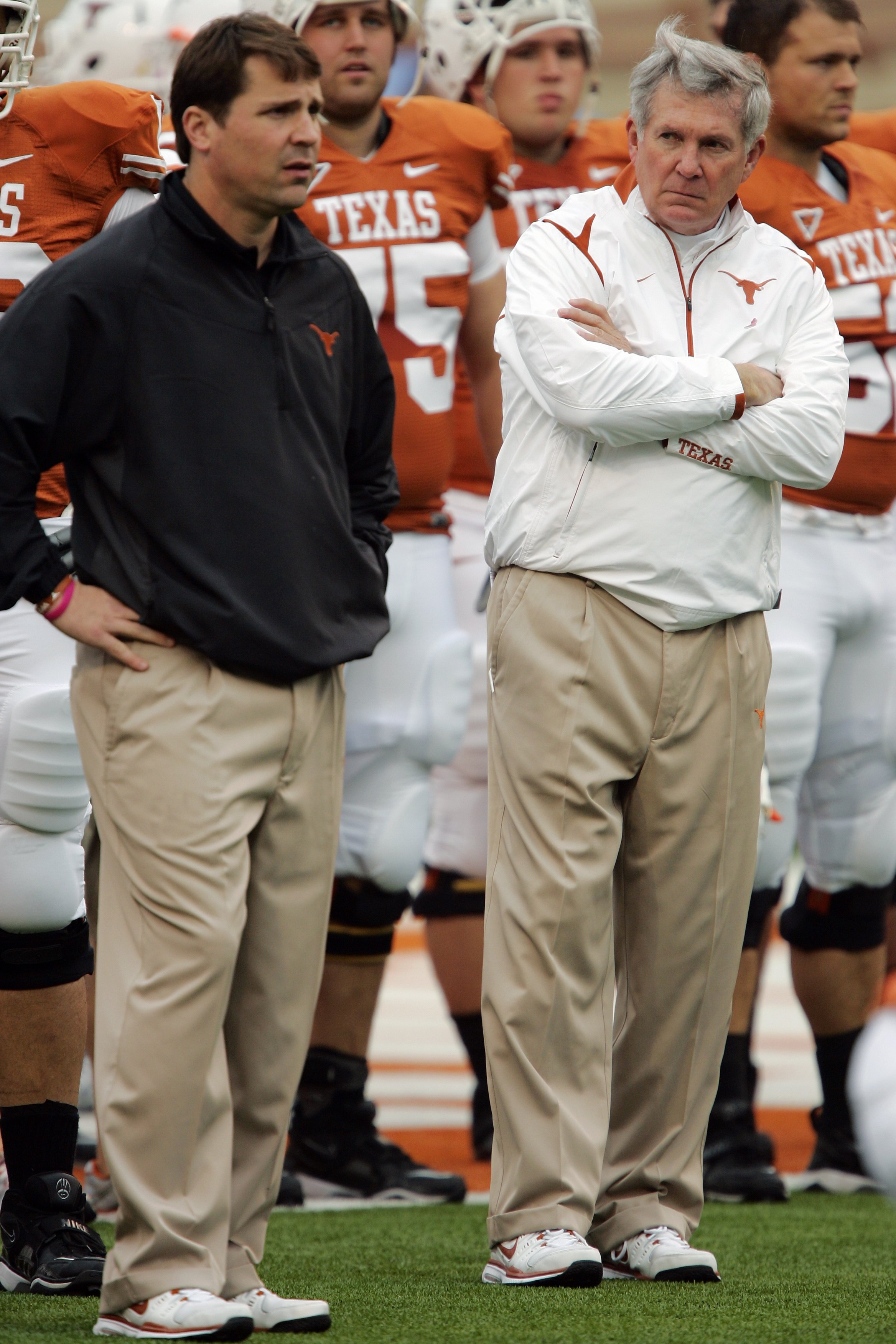 AUSTIN, TX - OCTOBER 10:  Defensive coordinator Will Muschamp and head coach Mack Brown of the Texas Longhorns lead their team in pregame drills before playing the Colorado Buffaloes  on October 10, 2009 at Darrell K Royal-Texas Memorial Stadium in Austin