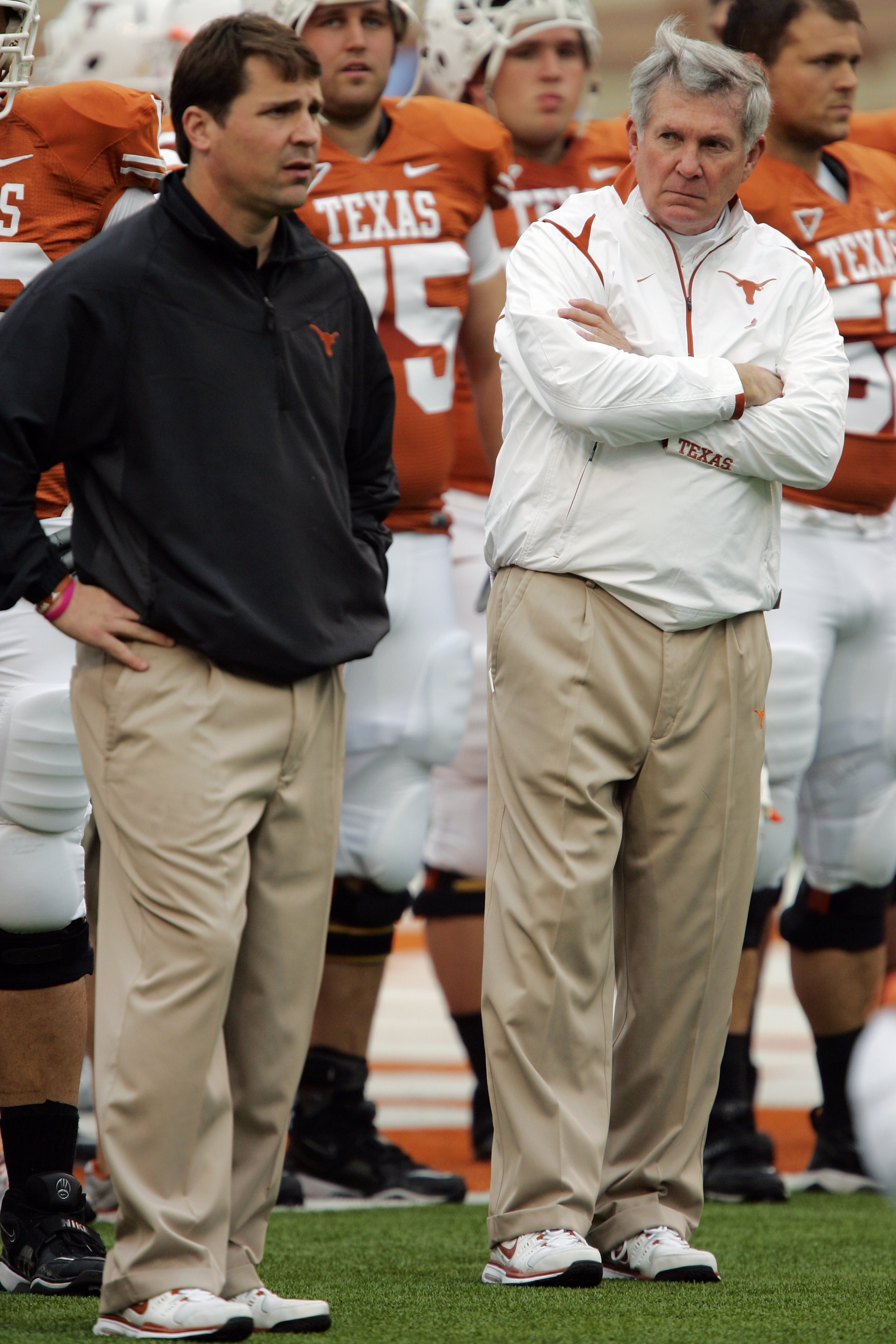 AUSTIN, TX - OCTOBER 10:  Defensive coordinator Will Muschamp and head coach Mack Brown of the Texas Longhorns lead their team in pregame drills before playing the Colorado Buffaloes  on October 10, 2009 at Darrell K Royal-Texas Memorial Stadium in Austin