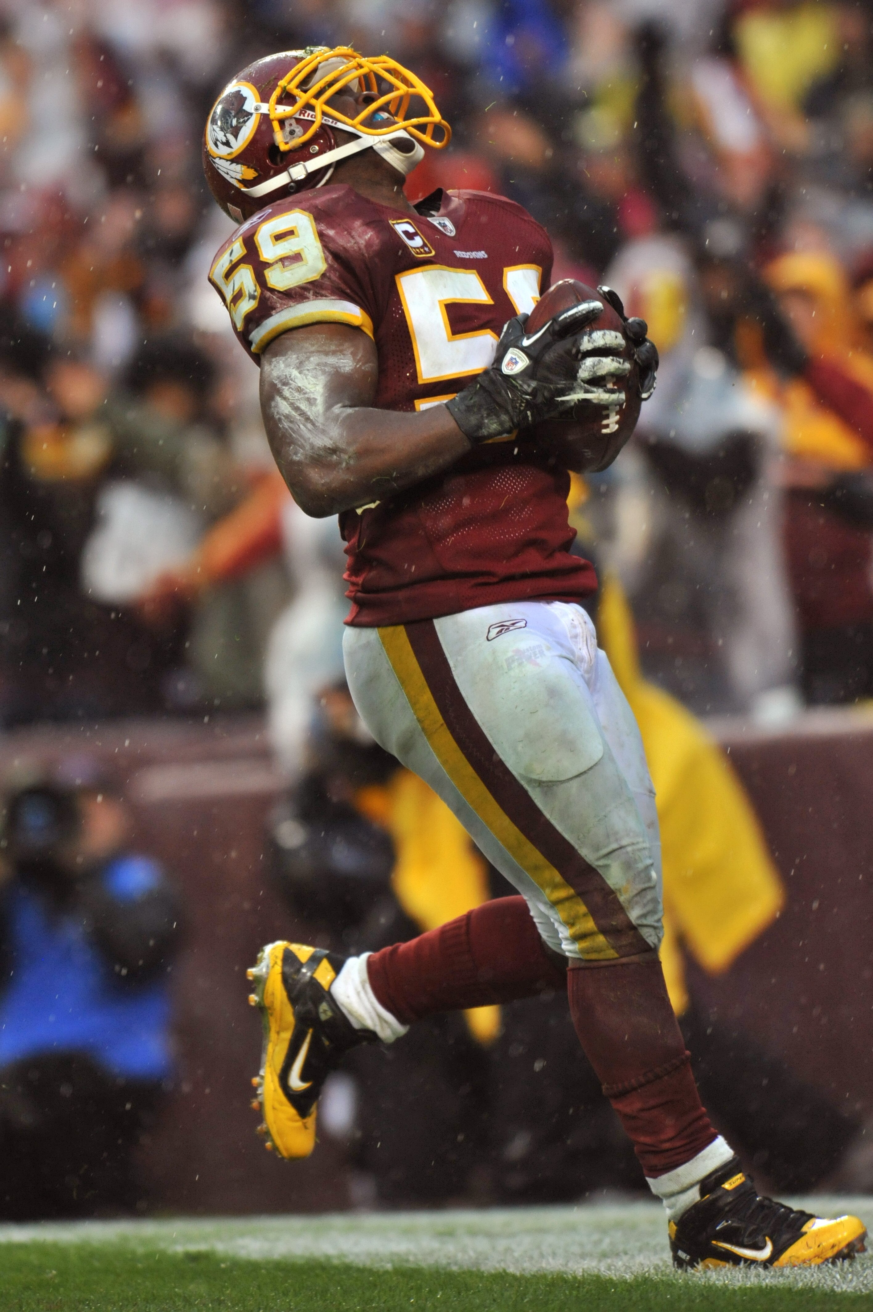 LANDOVER, MD - DECEMBER 12:  London Fletcher #59 of the Washington Redskins celebrates a critical third quarter fumble recovery against the Tampa Bay Buccaneers at FedExField on December 12, 2010 in Landover, Maryland. The Buccaneers defeated the Redskins