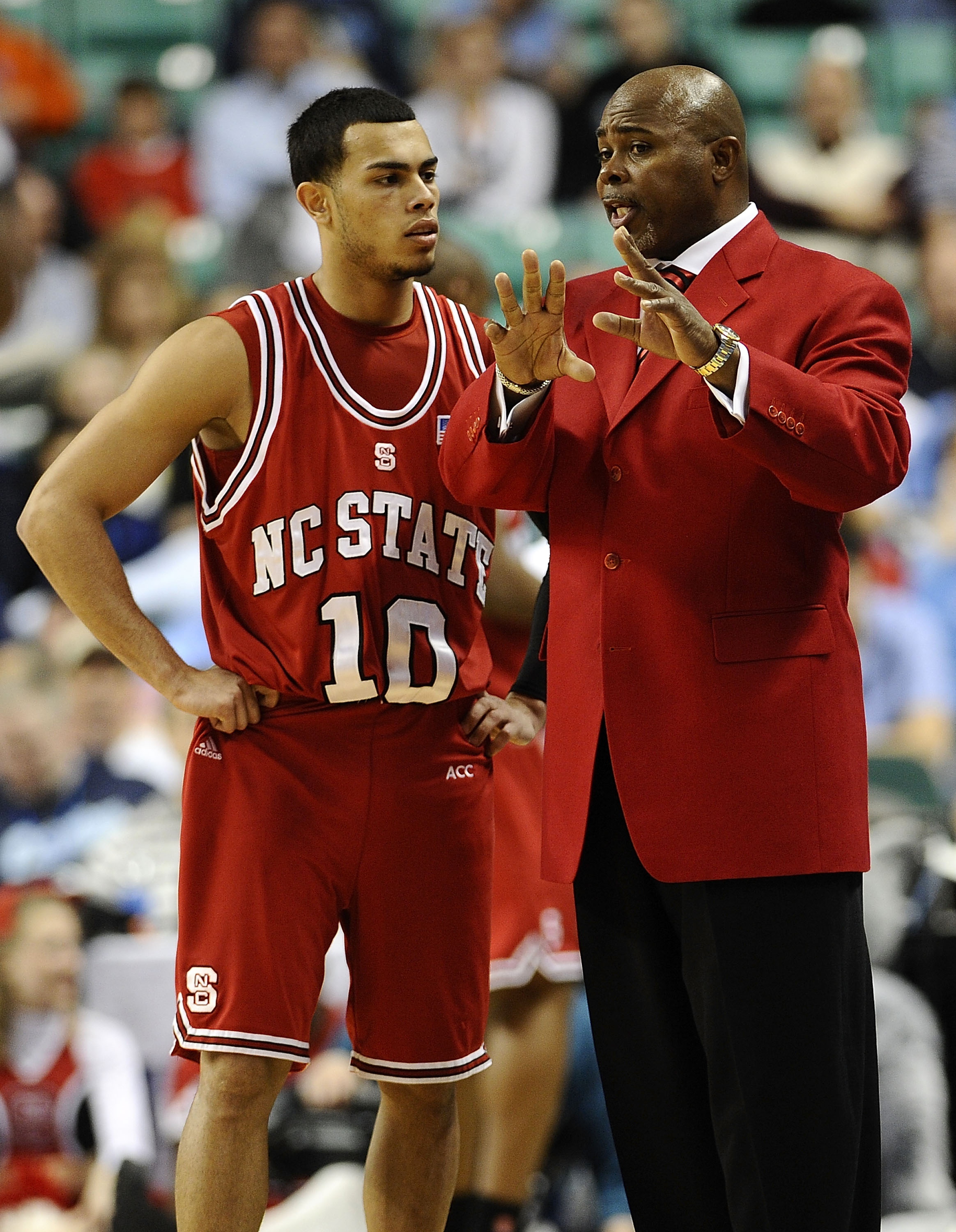 GREENSBORO, NC - MARCH 11: Javier Gonzalez  #10 confers with head coach Sidney Lowe of the Clemson Tigers during their game against the NC State Wolfpack in the first round in the 2010 ACC Men's Basketball Tournament at the Greensboro Coliseum on March 11