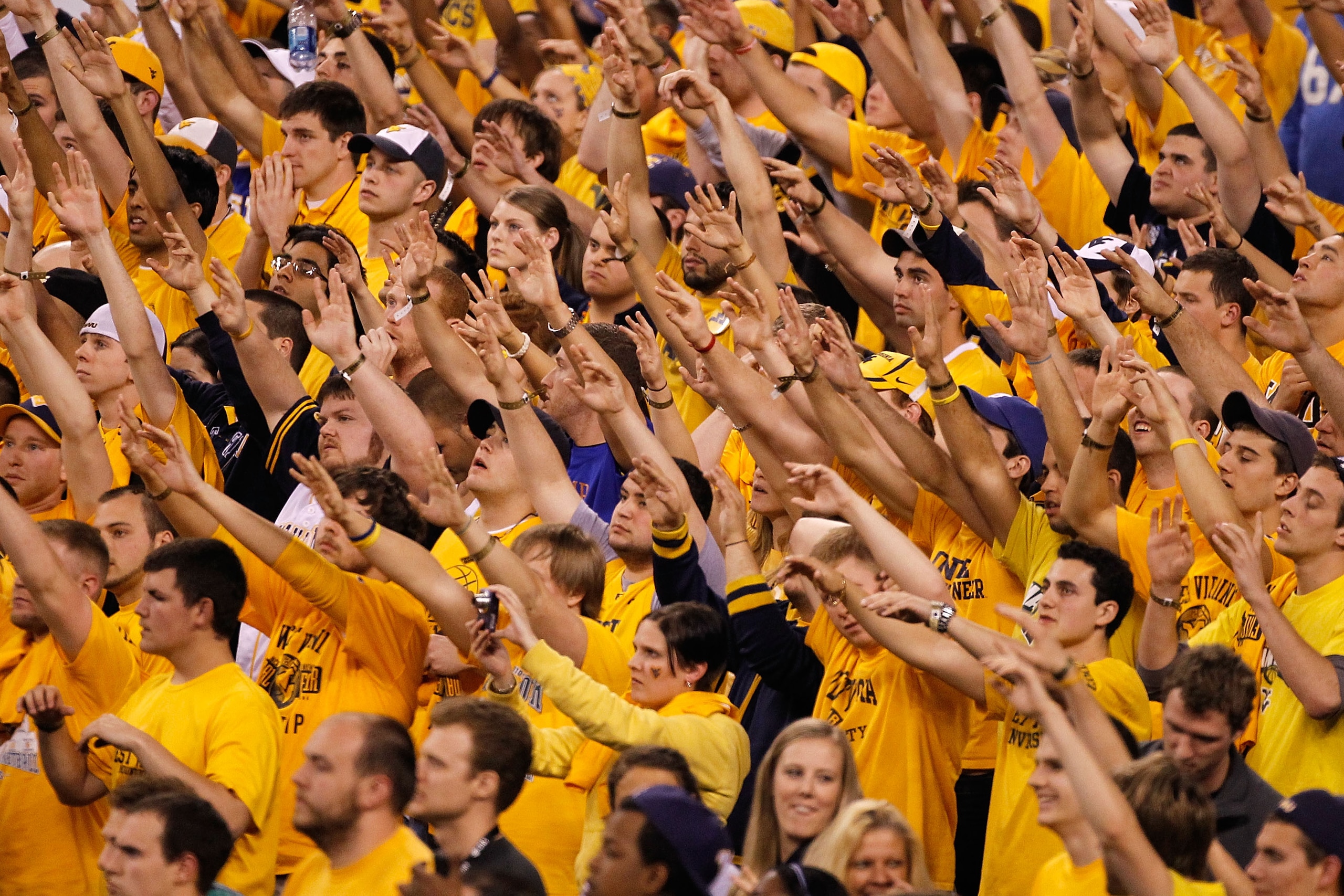 INDIANAPOLIS - APRIL 03:  Fans of the West Virginia Mountaineers cheer on their team in the second half against the Duke Blue Devils during the National Semifinal game of the 2010 NCAA Division I Men's Basketball Championship at Lucas Oil Stadium on April