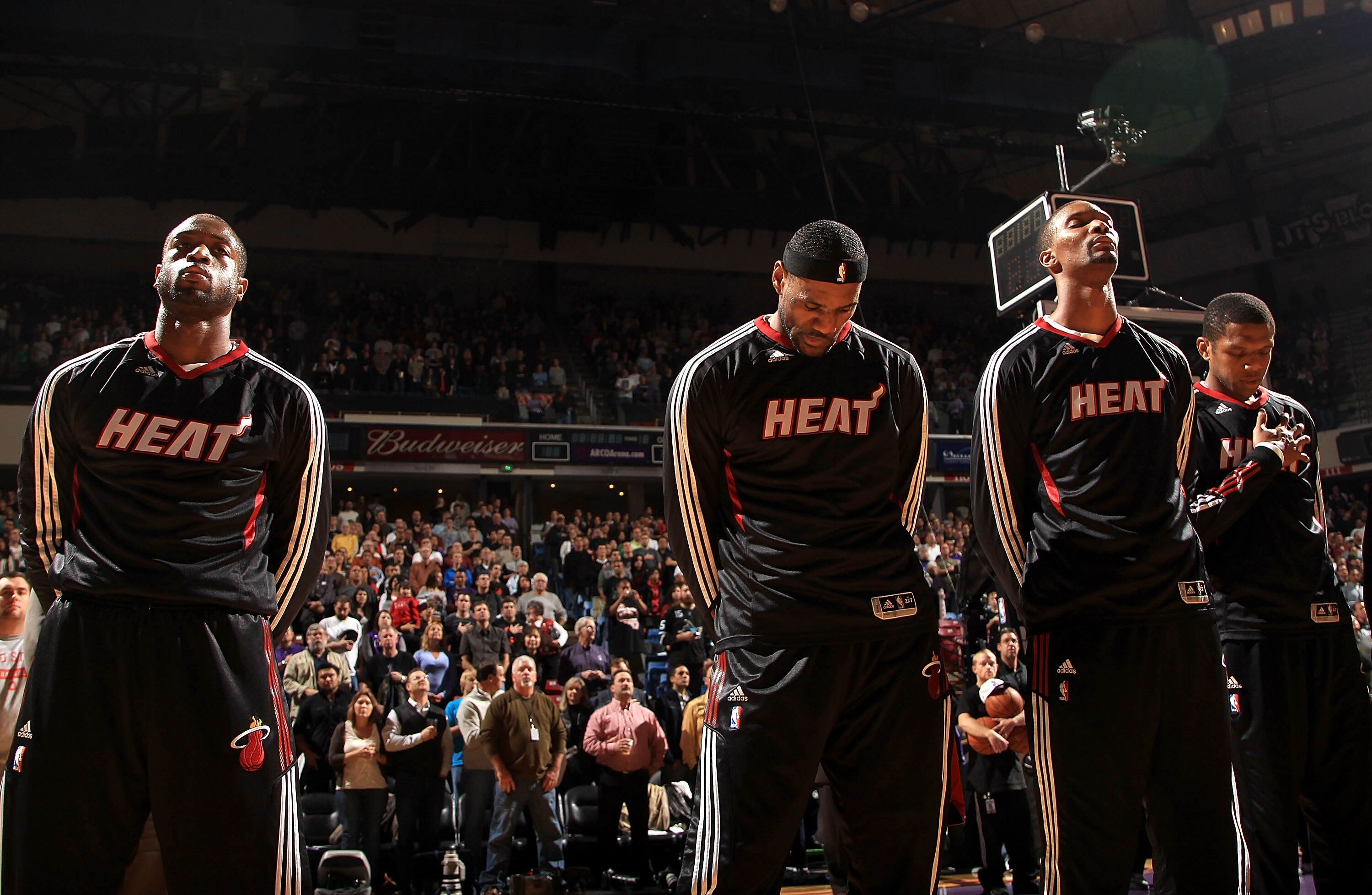 SACRAMENTO, CA - DECEMBER 11:  Dwayne Wade #3, Lebron James #6 and Chris Bosh #1 of the Miami Heat stand for the National Anthem before their game against the Sacramento Kings at ARCO Arena on December 11, 2010 in Sacramento, California.  NOTE TO USER: Us
