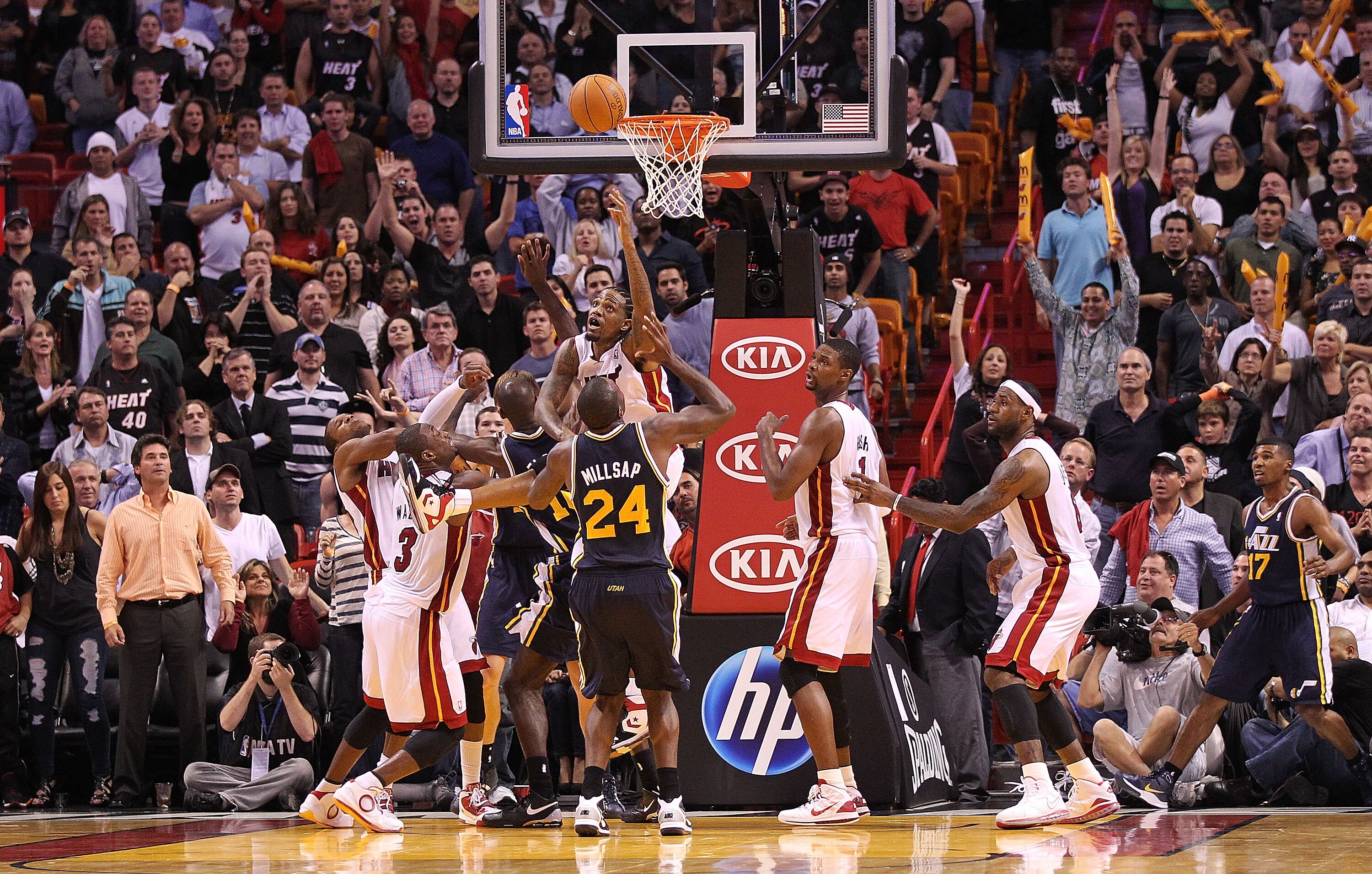 MIAMI - NOVEMBER 09:  Udonis Haslem #40 of the Miami Heat fights for a rebound against Paul Millsap #24 of the Utah Jazz during a game at the American Airlines Arena on November 9, 2010 in Miami, Florida. NOTE TO USER: User expressly acknowledges and agre
