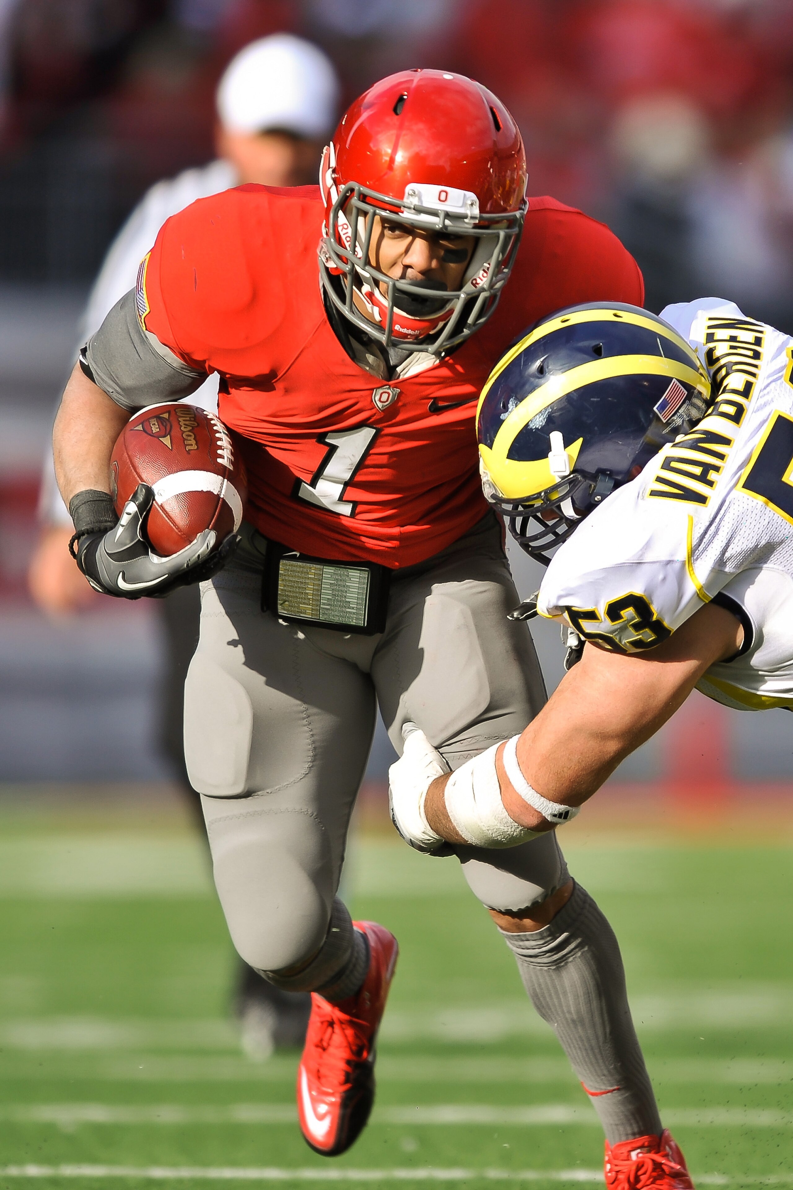 COLUMBUS, OH - NOVEMBER 27:  Dan Herron #1 of the Ohio State Buckeyes  runs with the ball against the Michigan Wolverines at Ohio Stadium on November 27, 2010 in Columbus, Ohio.  (Photo by Jamie Sabau/Getty Images)