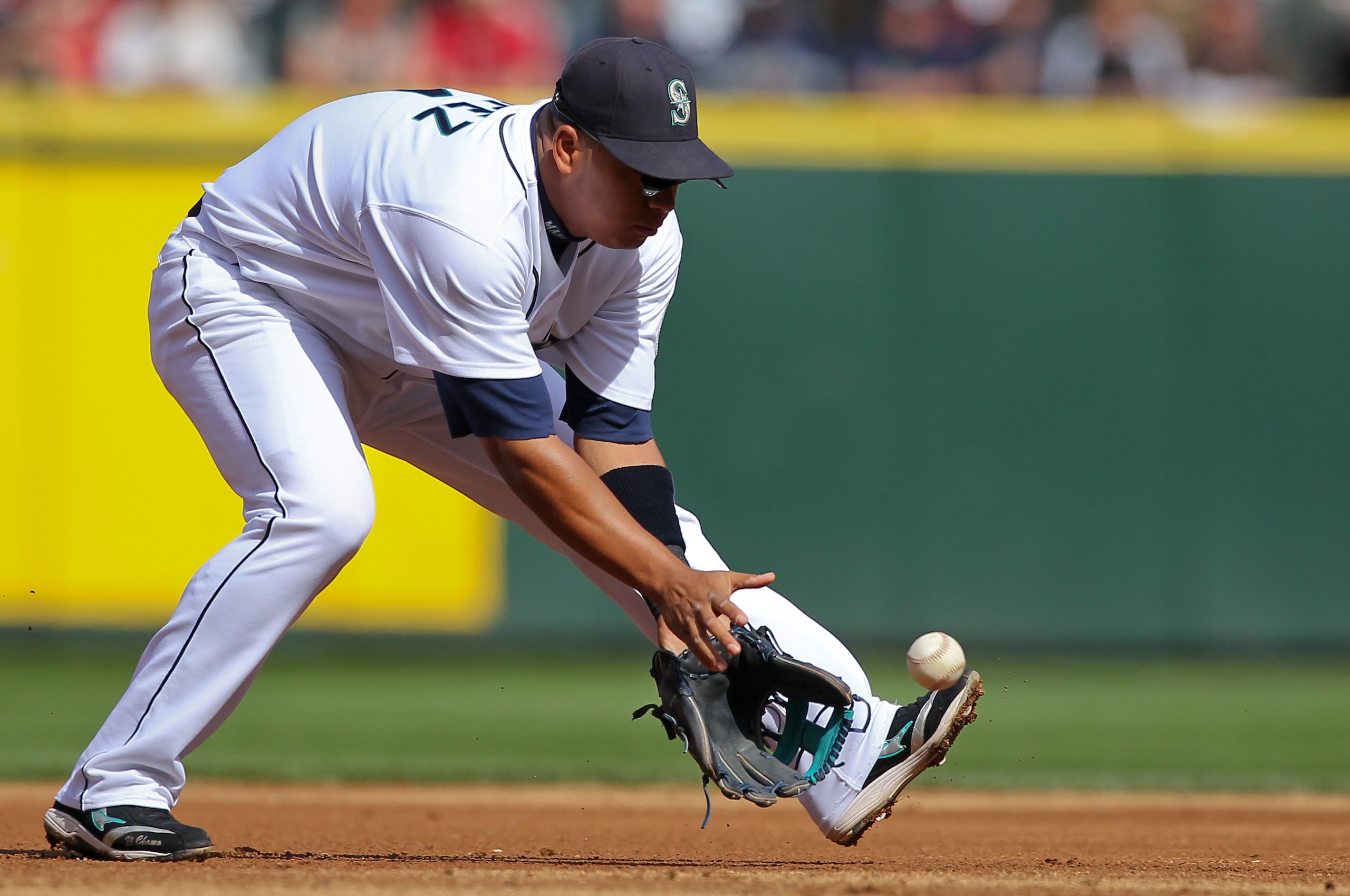 SEATTLE - SEPTEMBER 19:  Third baseman Jose Lopez #4 of the Seattle Mariners fields a grounder against the Texas Rangers at Safeco Field on September 19, 2010 in Seattle, Washington. The Mariners won 2-1. (Photo by Otto Greule Jr/Getty Images)