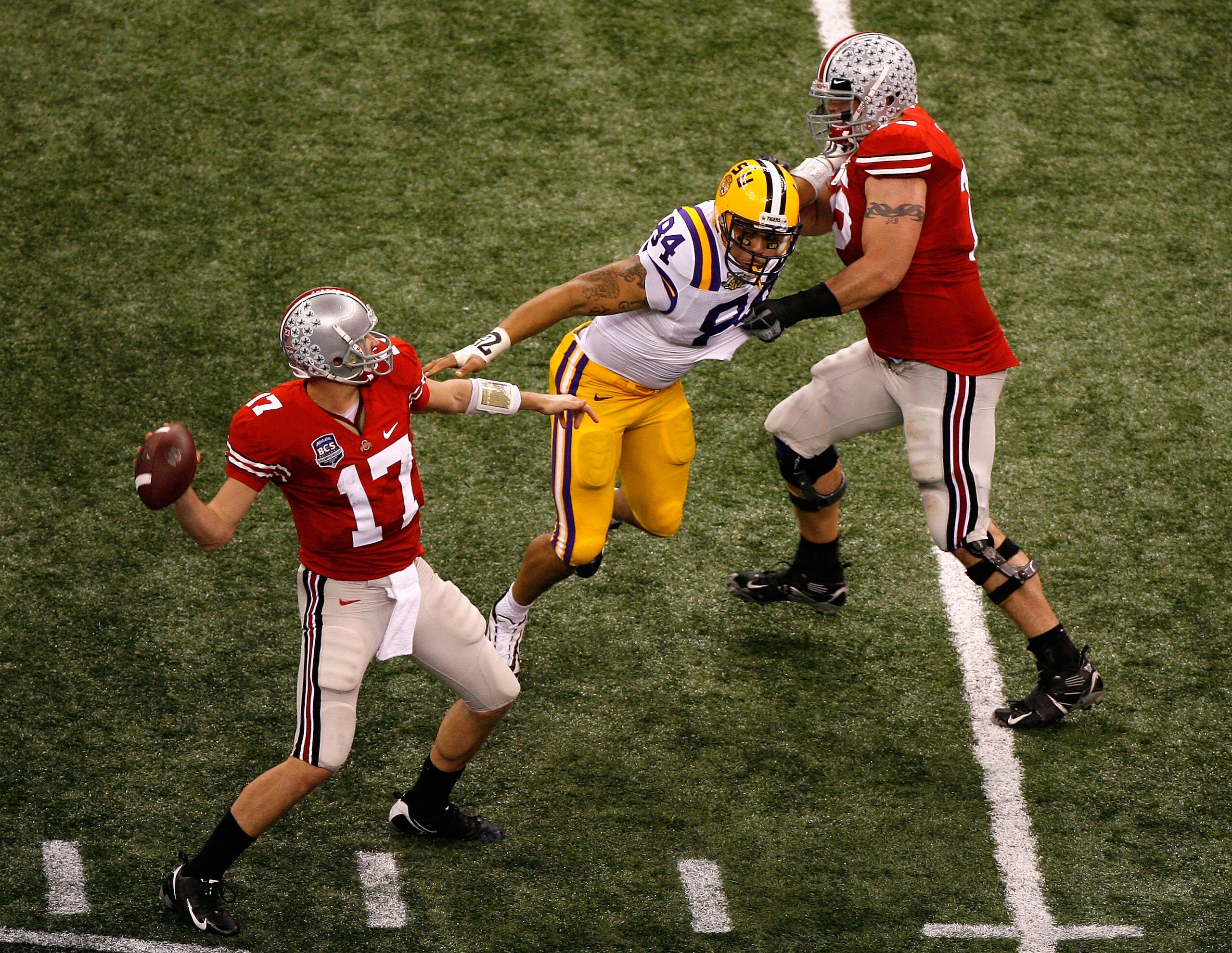 NEW ORLEANS - JANUARY 07:  Quarterback Todd Boeckmann #17 of the Ohio State Buckeyes looks to pass under pressure from Rahim Alem #84 of the Louisiana State University Tigers during the AllState BCS National Championship on January 7, 2008 at the Louisian