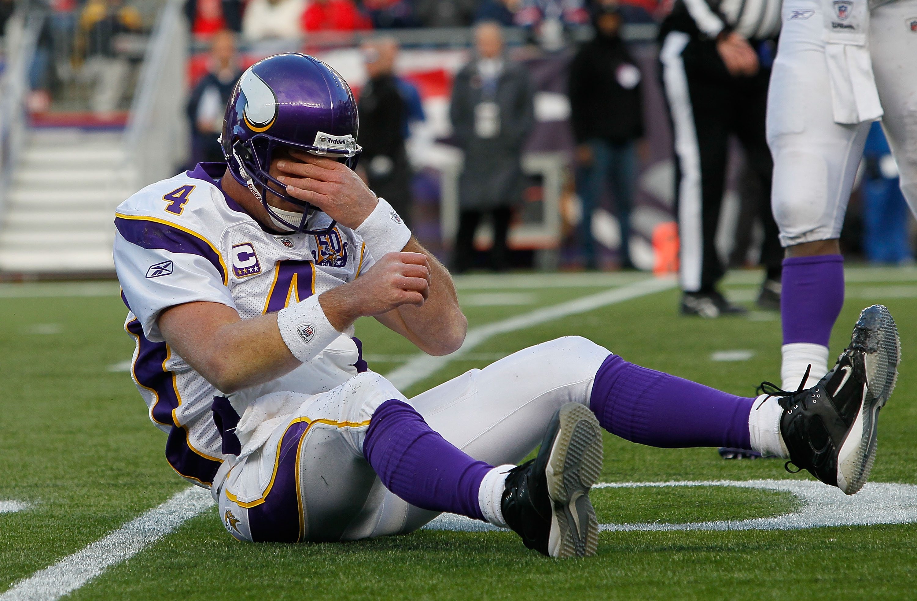 FOXBORO, MA - OCTOBER 31:  Brett Favre #4 of the Minnesota Vikings reacts after being knocked down in the first half against the New England Patriots at Gillette Stadium on October 31, 2010 in Foxboro, Massachusetts. (Photo by Jim Rogash/Getty Images)
