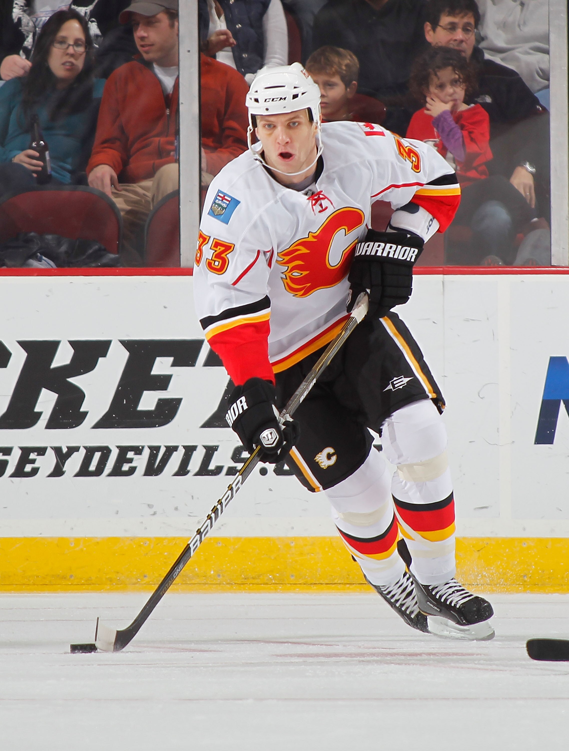 NEWARK, NJ - NOVEMBER 24:  Anton Babchuk #33 of the Calgary Flames skates during a hockey game against the New Jersey Devils at the Prudential Center on November 24, 2010 in Newark, New Jersey.  (Photo by Paul Bereswill/Getty Images)