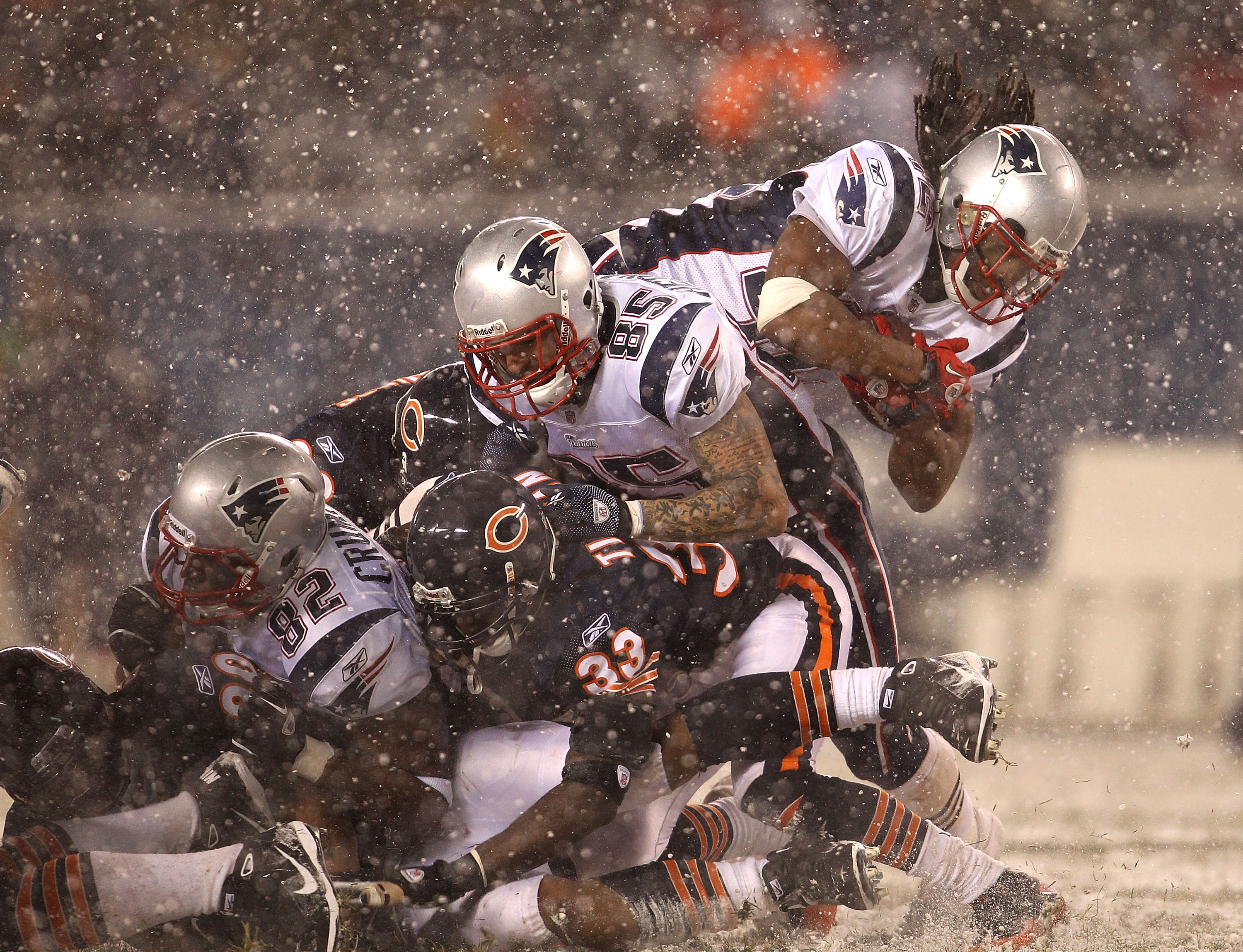 CHICAGO - DECEMBER 12: BenJarvus Green-Ellis #42 of the New England Patriots dives over linemen for a first down against the Chicago Bears at Soldier Field on December 12, 2010 in Chicago, Illinois. The Patriots defeated the Bears 36-7. (Photo by Jonathan